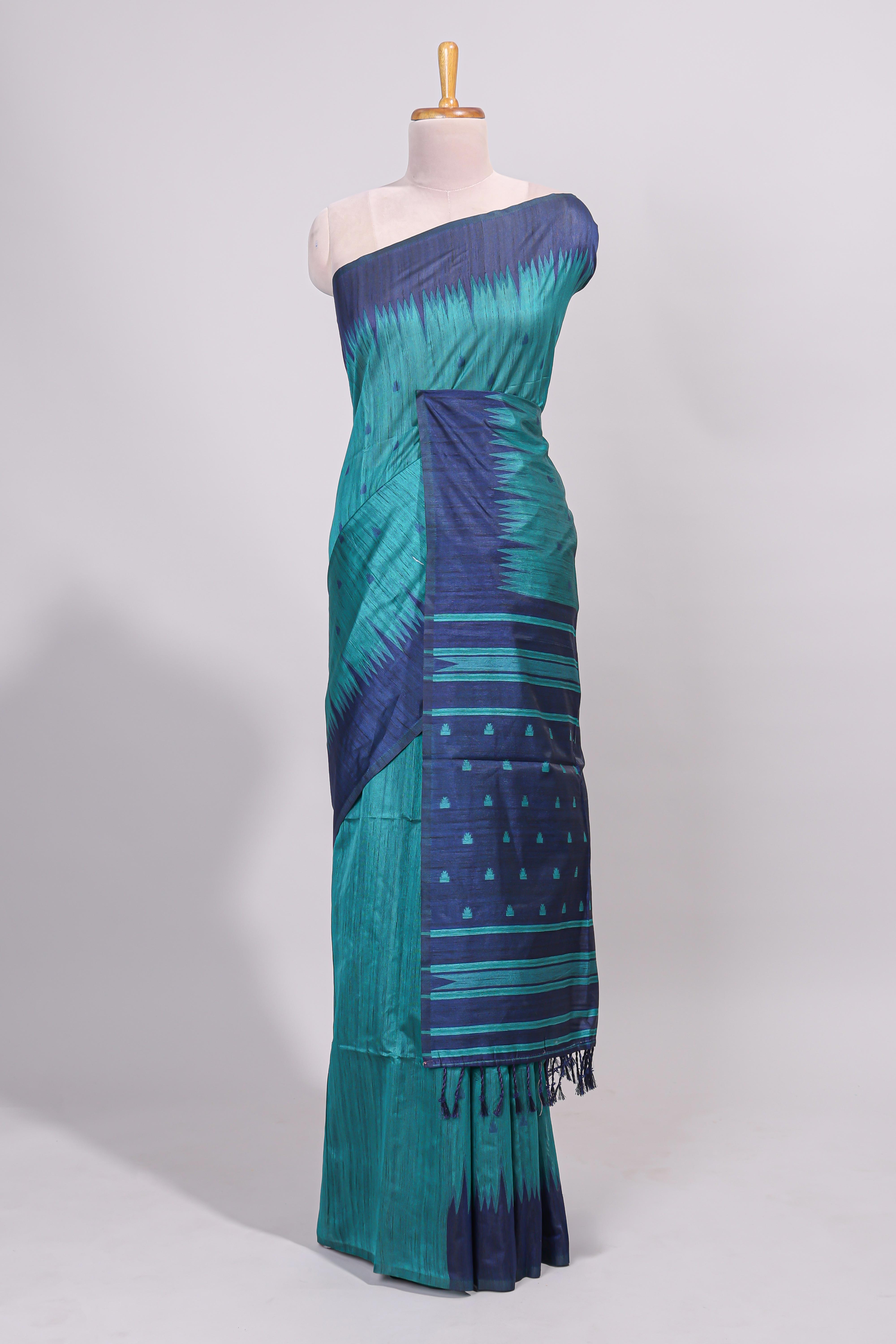 Green ikkat motifs design semi tussar saree with contrast border and striped blouse