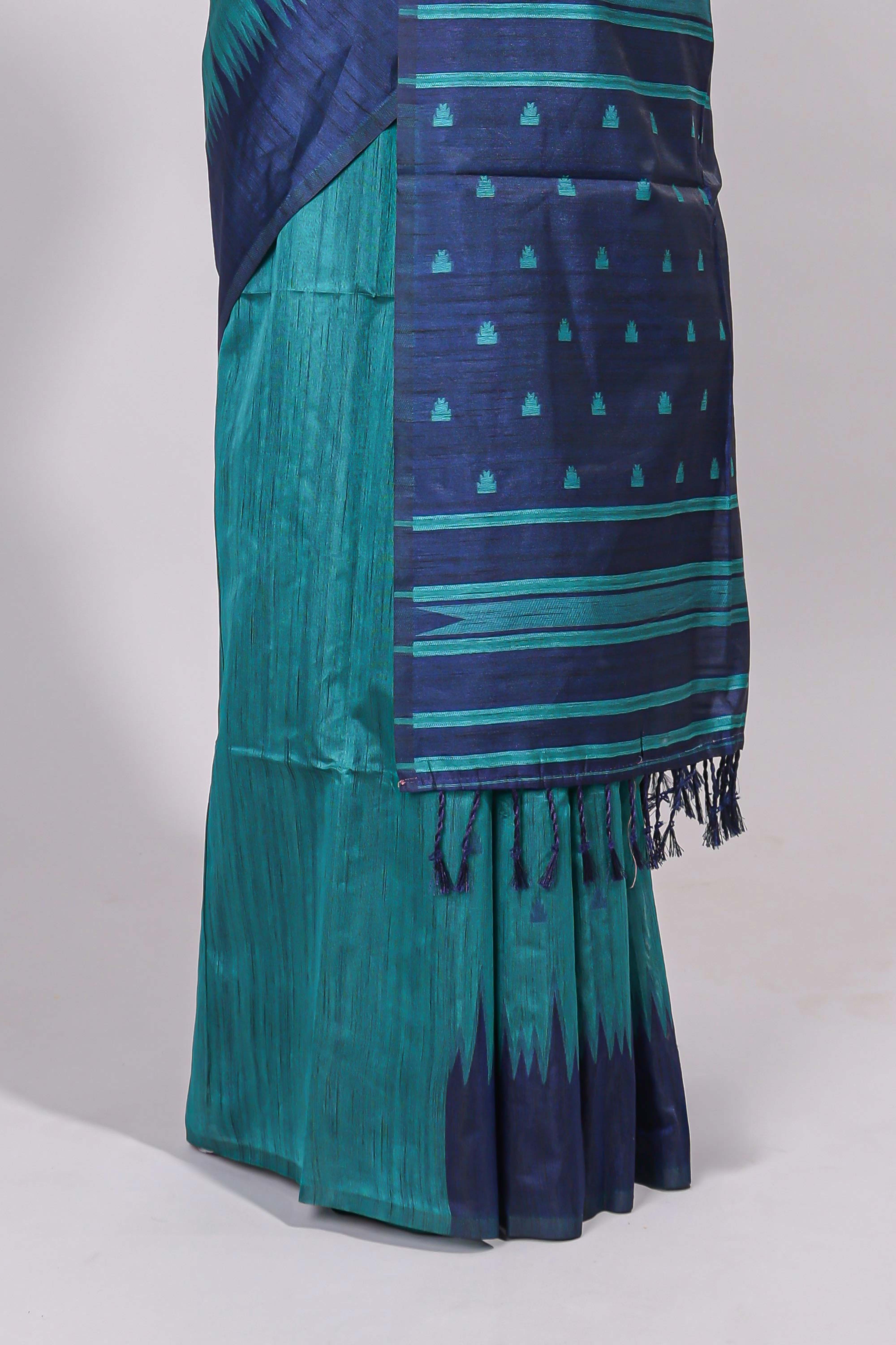 Green ikkat motifs design semi tussar saree with contrast border and striped blouse