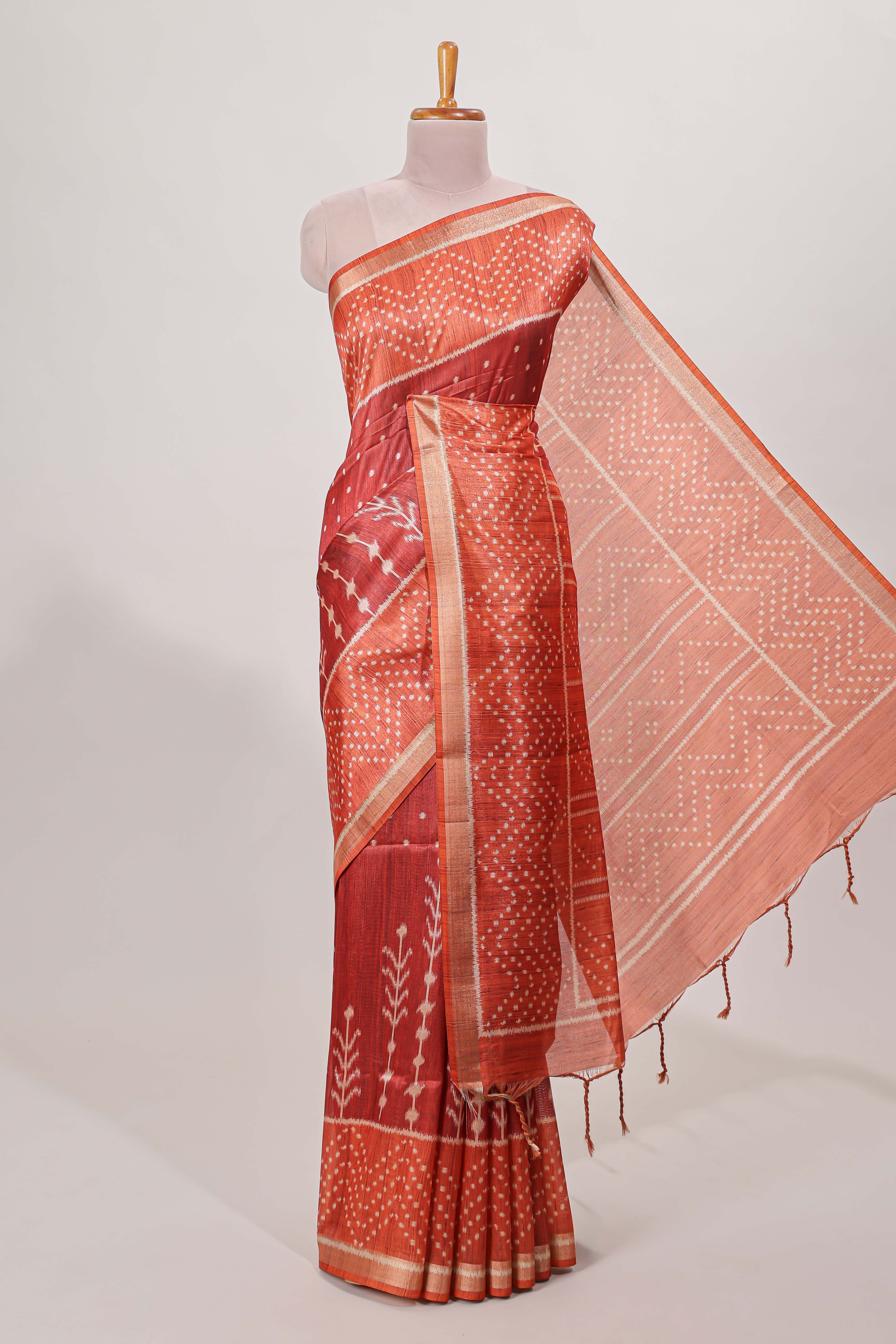 Rust maroon tussar saree all over body ikkat print with contrast small zari border , bandhani print pallu and ikkat contrast blouse