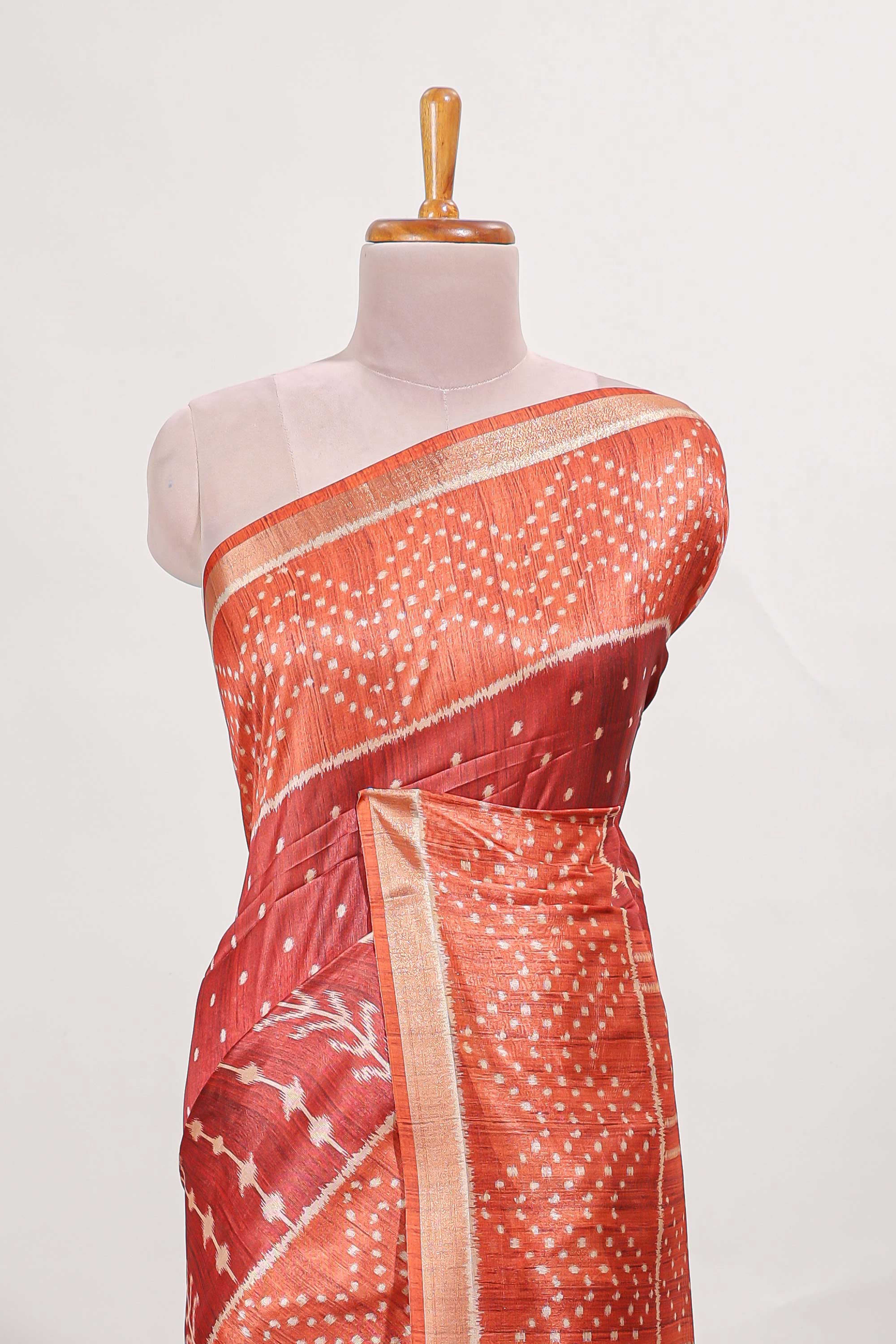 Rust maroon tussar saree all over body ikkat print with contrast small zari border , bandhani print pallu and ikkat contrast blouse