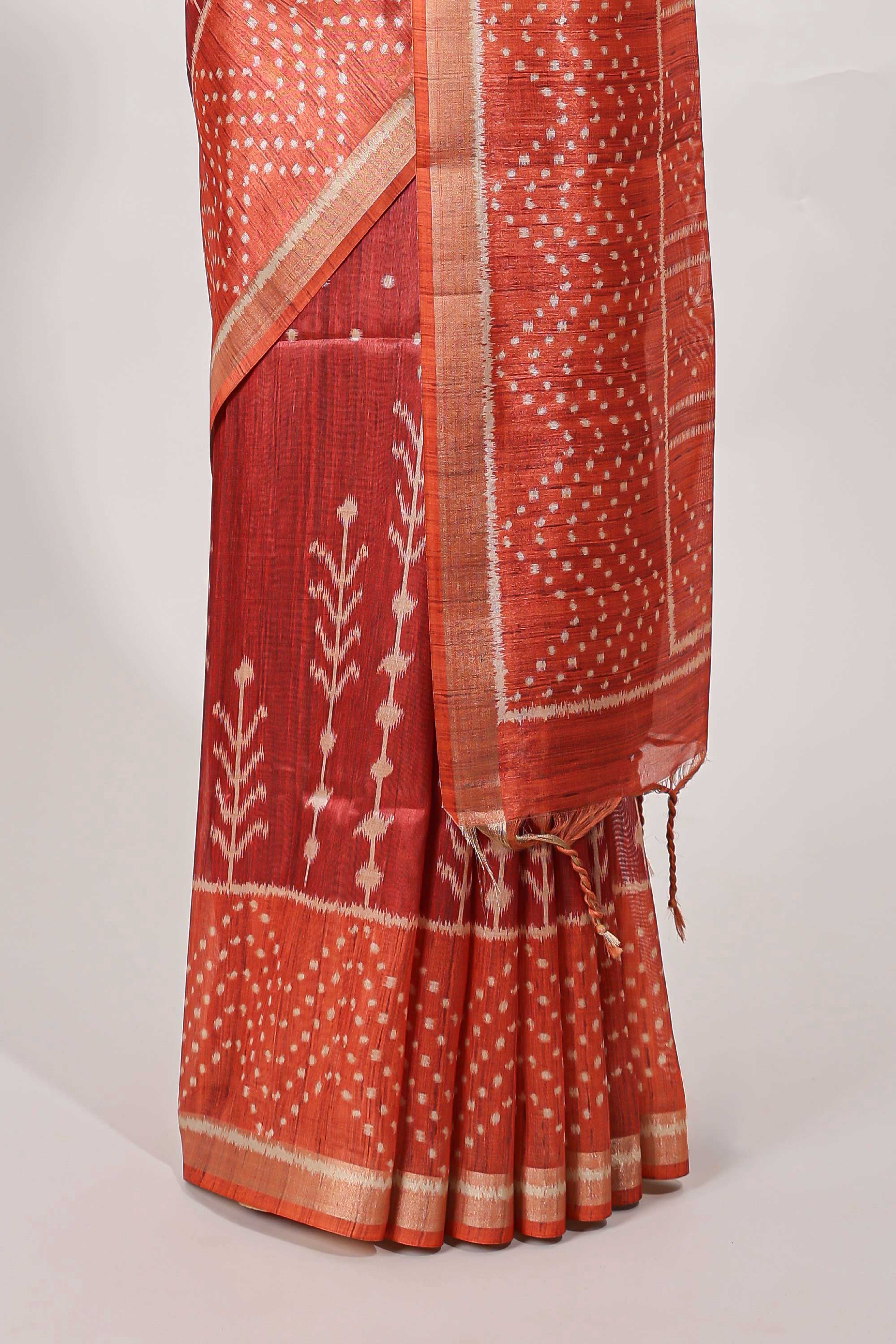 Rust maroon tussar saree all over body ikkat print with contrast small zari border , bandhani print pallu and ikkat contrast blouse