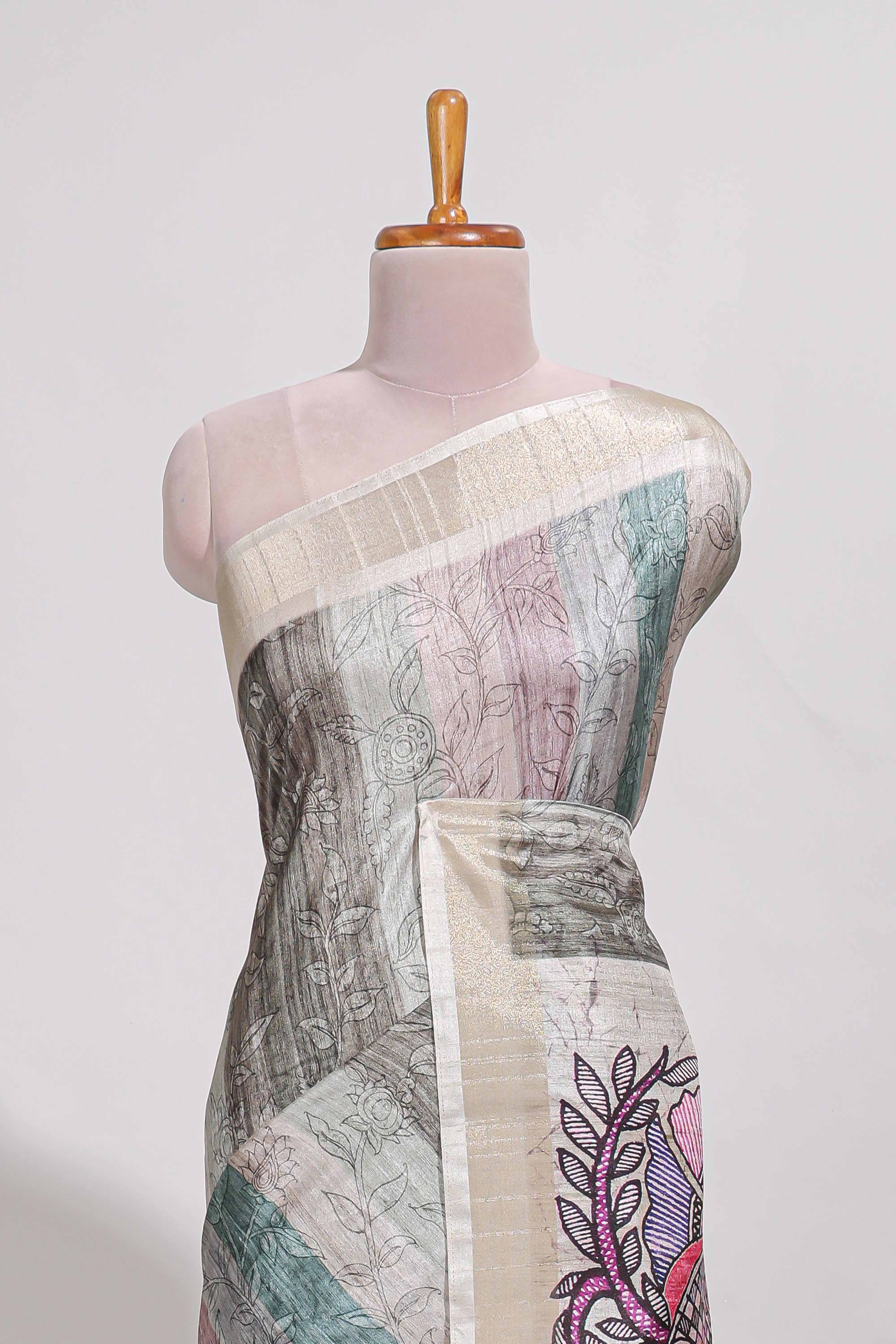 Pastel green colour kalamakri arttussar sareewith floral creeper prints zari border and kalamkari peacock motif print pallu
