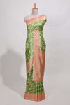 green colour ikkatdesignsemi tussar saree with contrast border andblouse