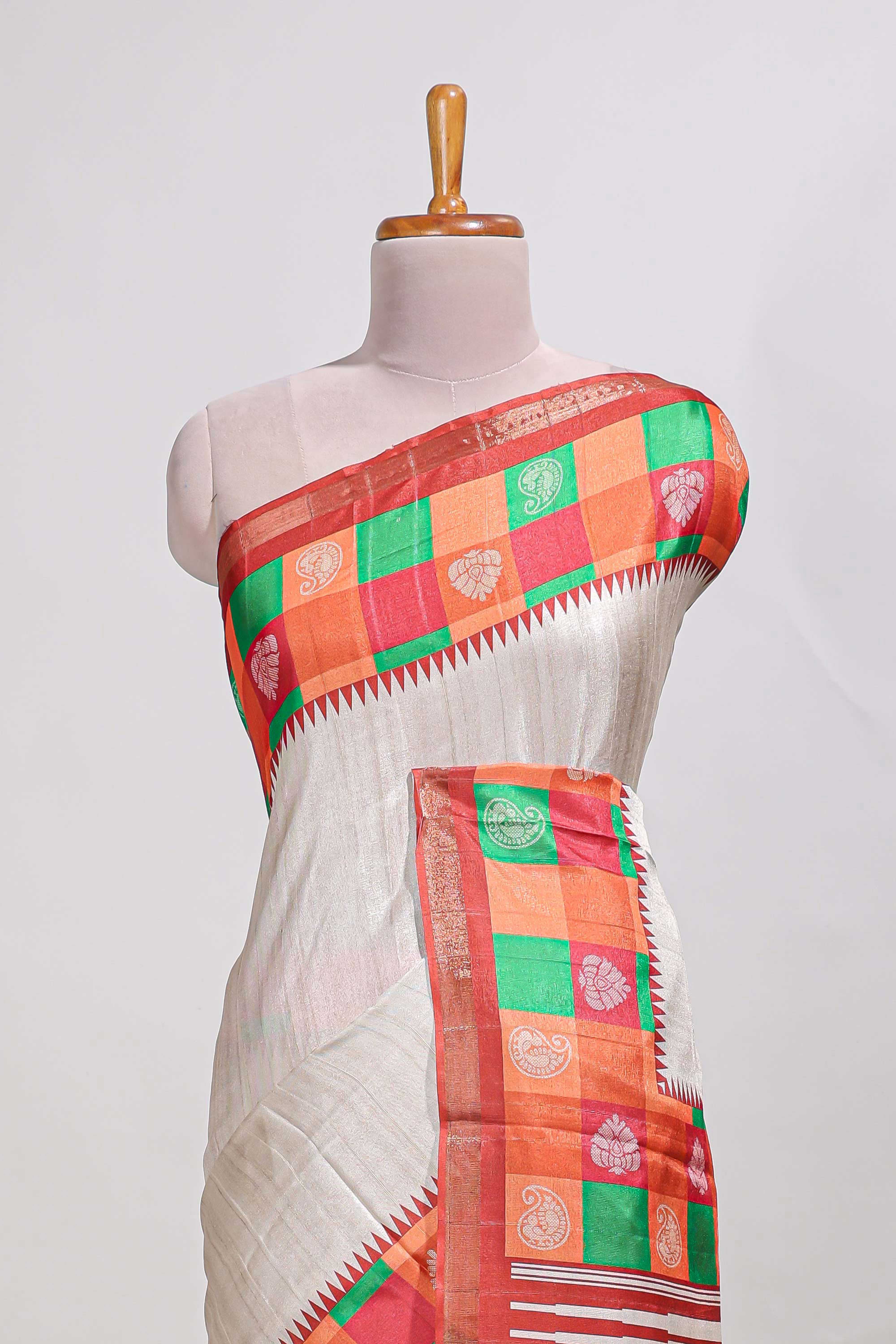 Cream coloursemi tussar sareeandcontrast checkedborder withcontrastchecked blouse