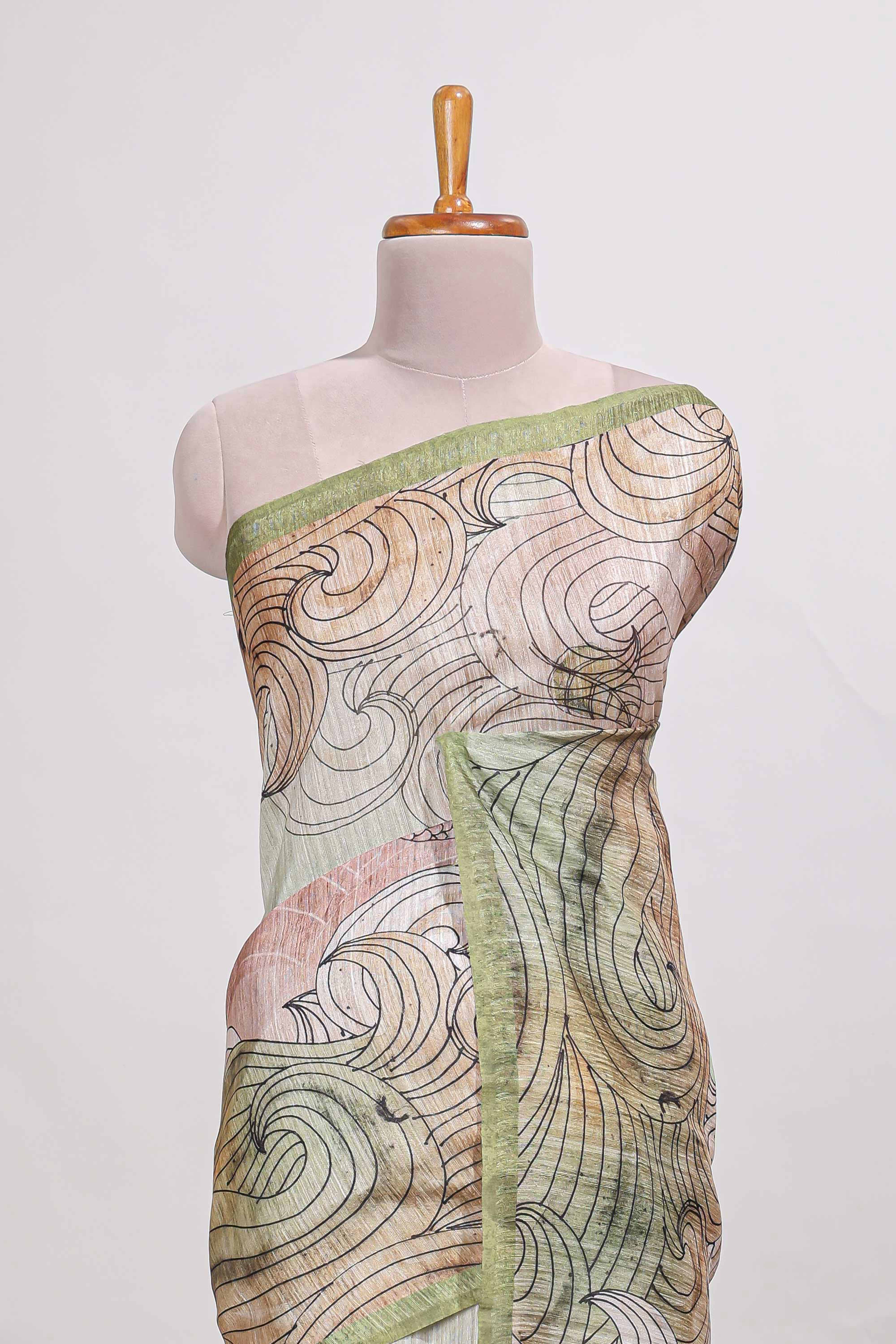 Light green colourprintedsemi tussar saree with pippingborder and leaf printed matching blouse