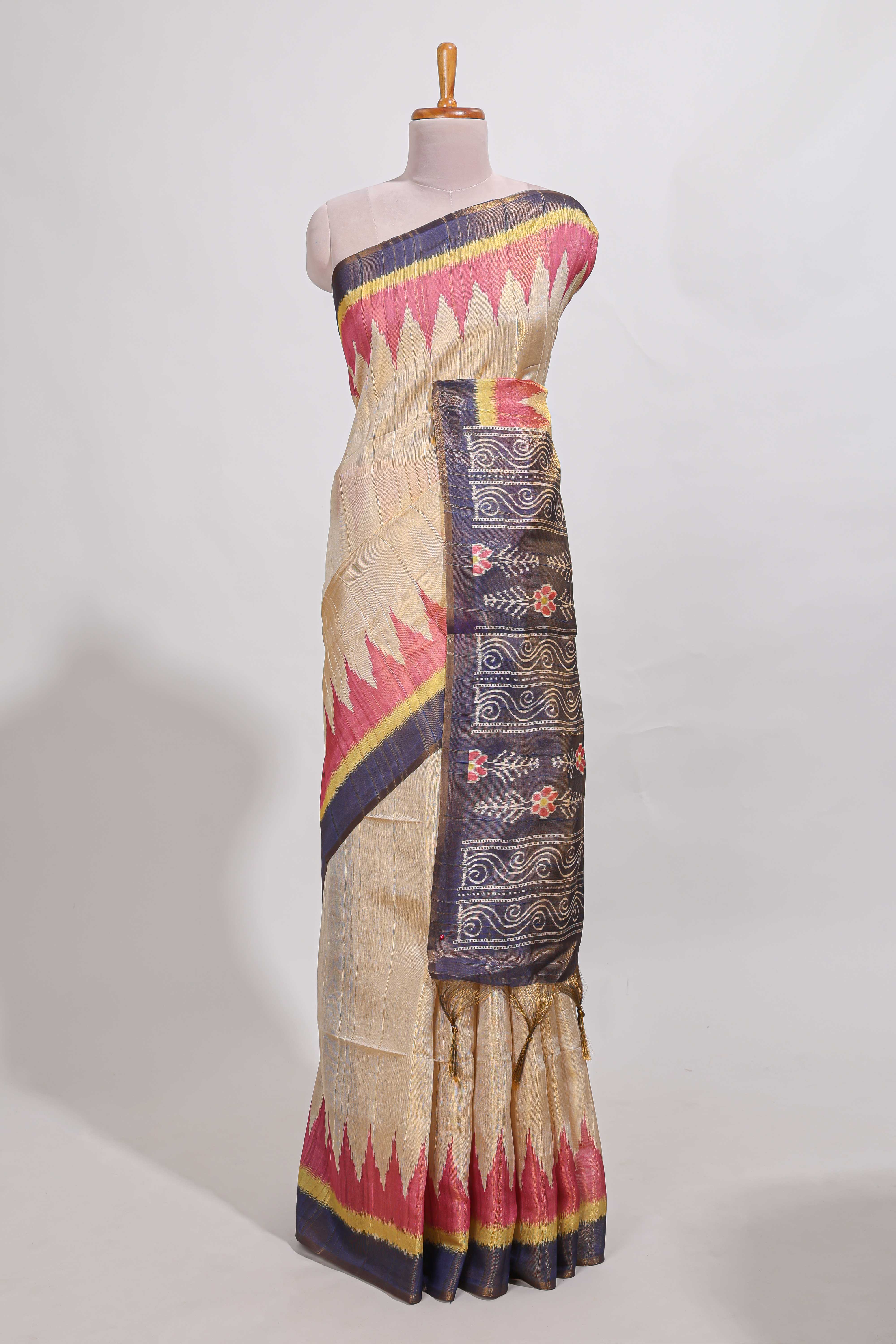Beige colour semi tussar saree with temple border and tissue blouse
