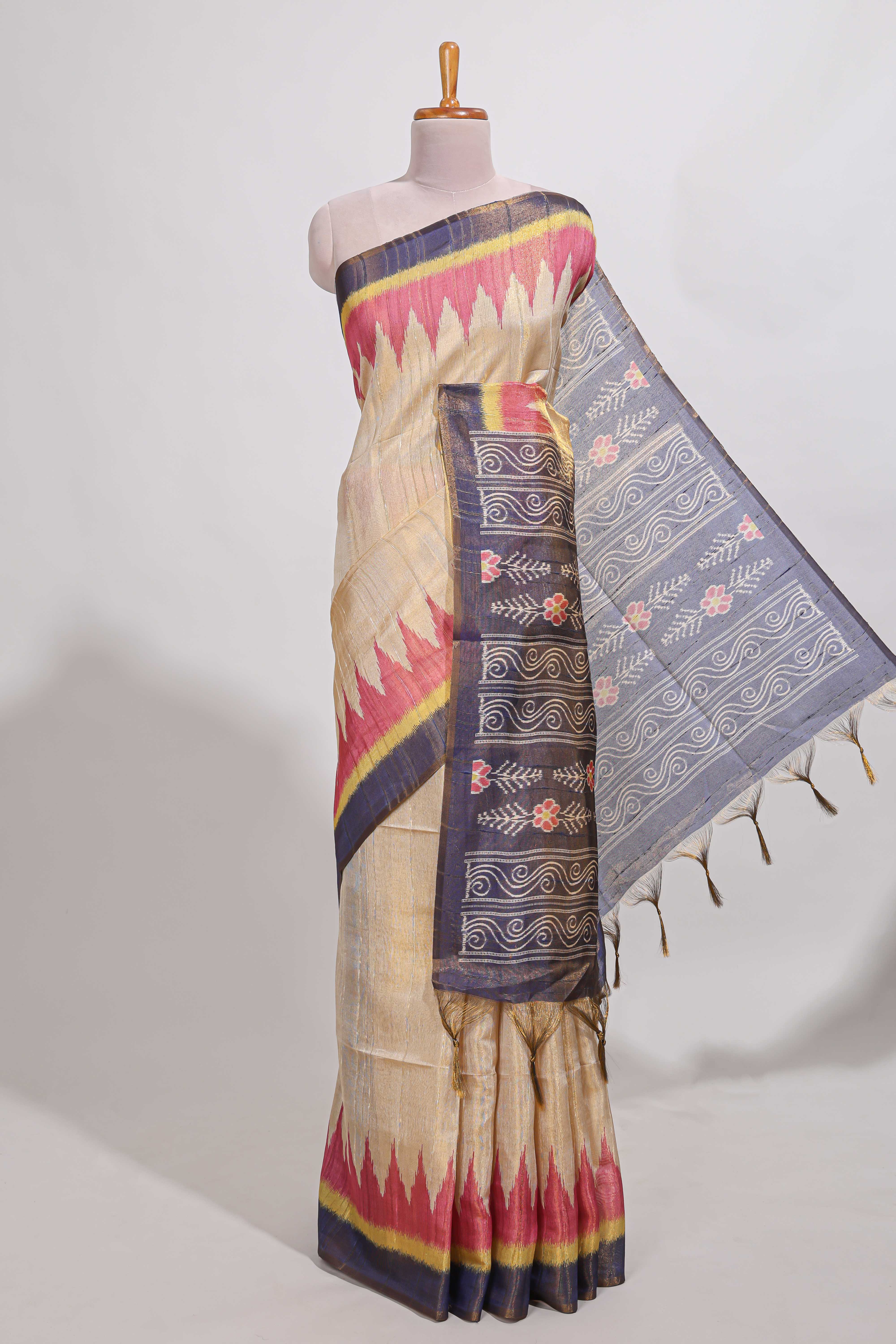 Beige colour semi tussar saree with temple border and tissue blouse