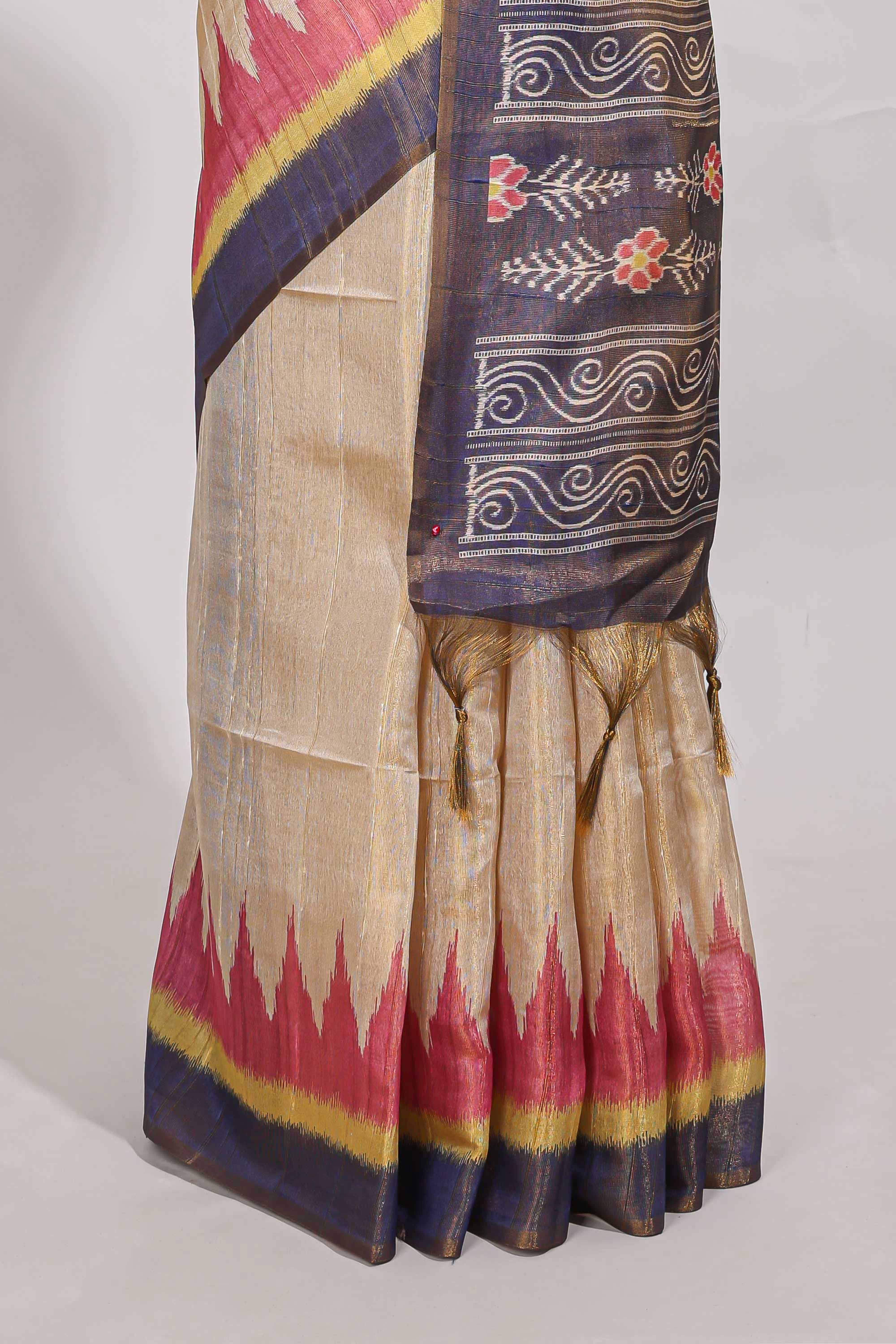 Beige colour semi tussar saree with temple border and tissue blouse