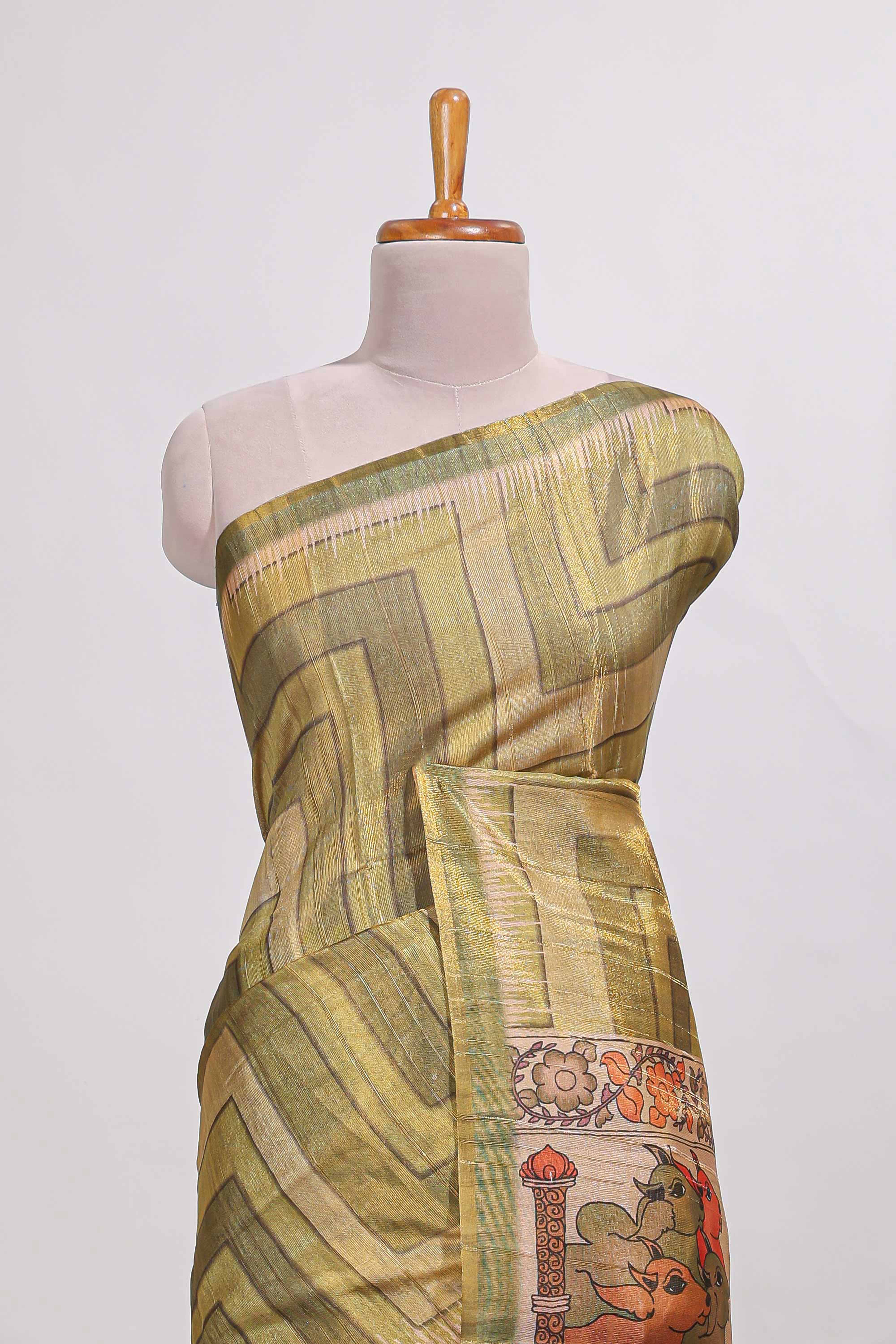 Olive greenabstract geometric pattern semi tussar saree with village art print pallu and tissue blouse