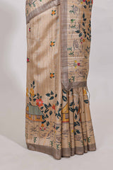 Beige colour artistic village art tussar saree with small border and matching pallu