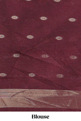 Maroon shimmering zari tussar saree with zari detailing temple pattern borders , and a rich zari pallu