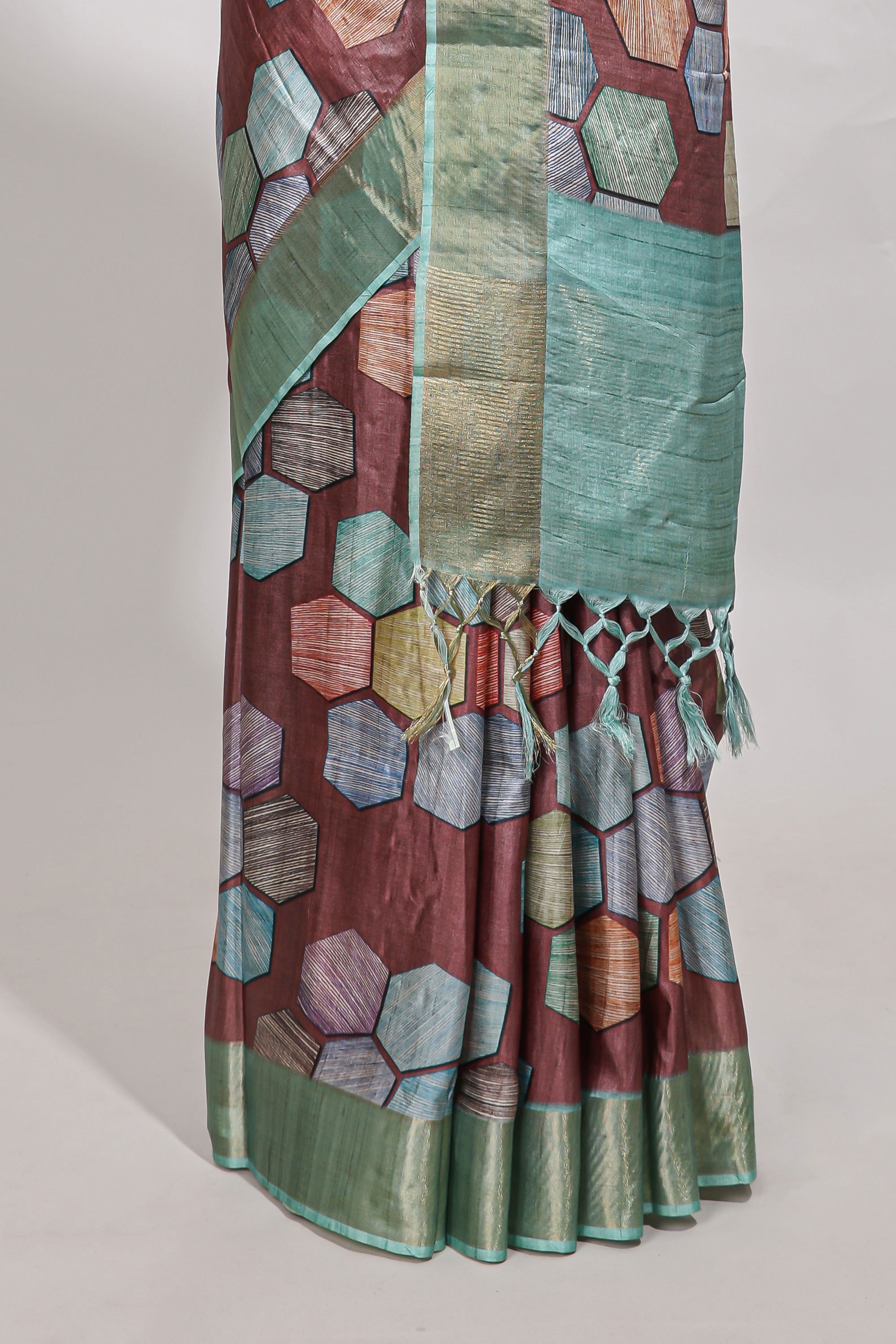Brick red geometrical tussar silk saree multi coloured honeycomb geomatricpatterns ,rich matching pallu along with tassles