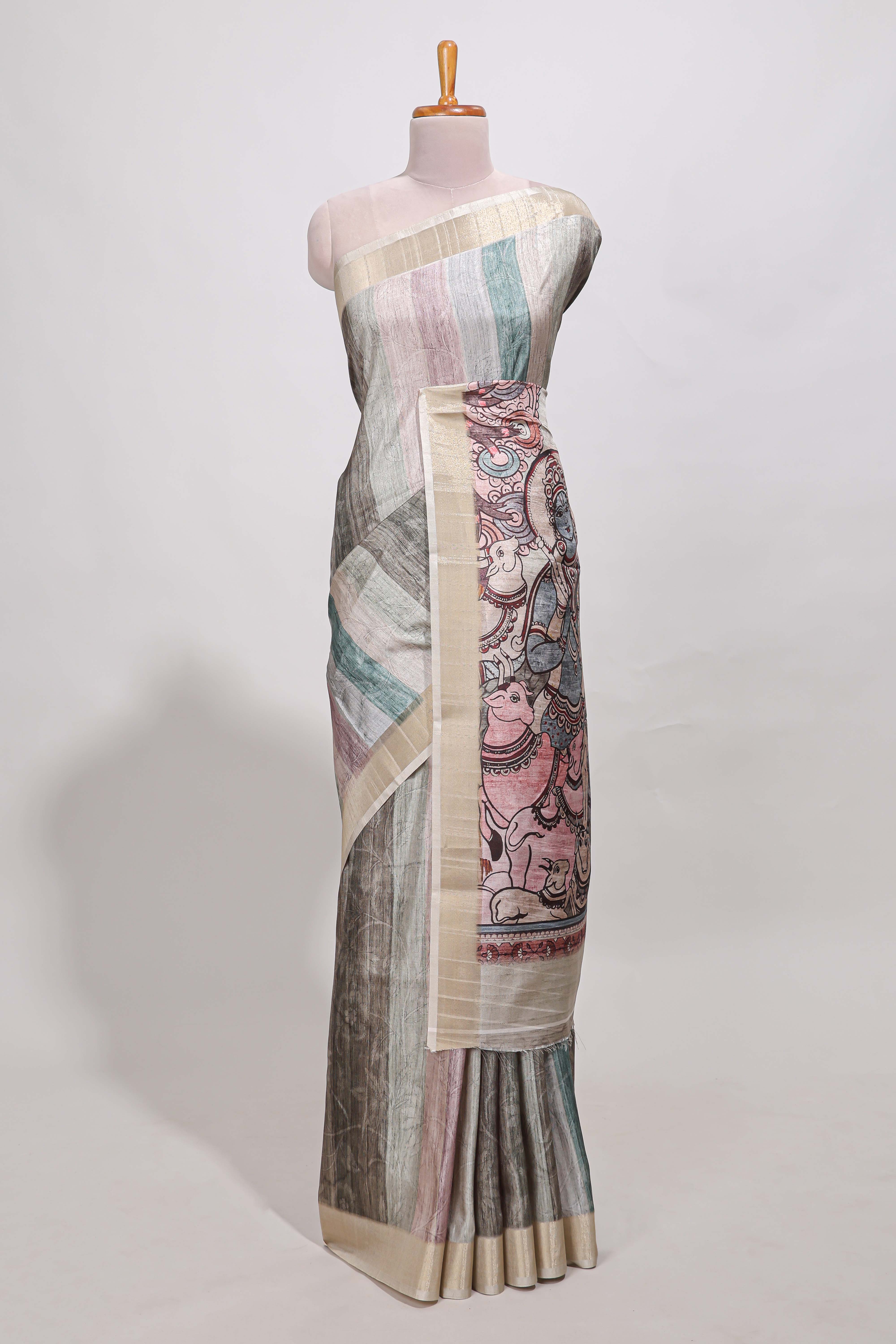 Multi colour kalamakri tussar saree body with floral creeper prints zari border and kalamkari peacock motif print pallu
