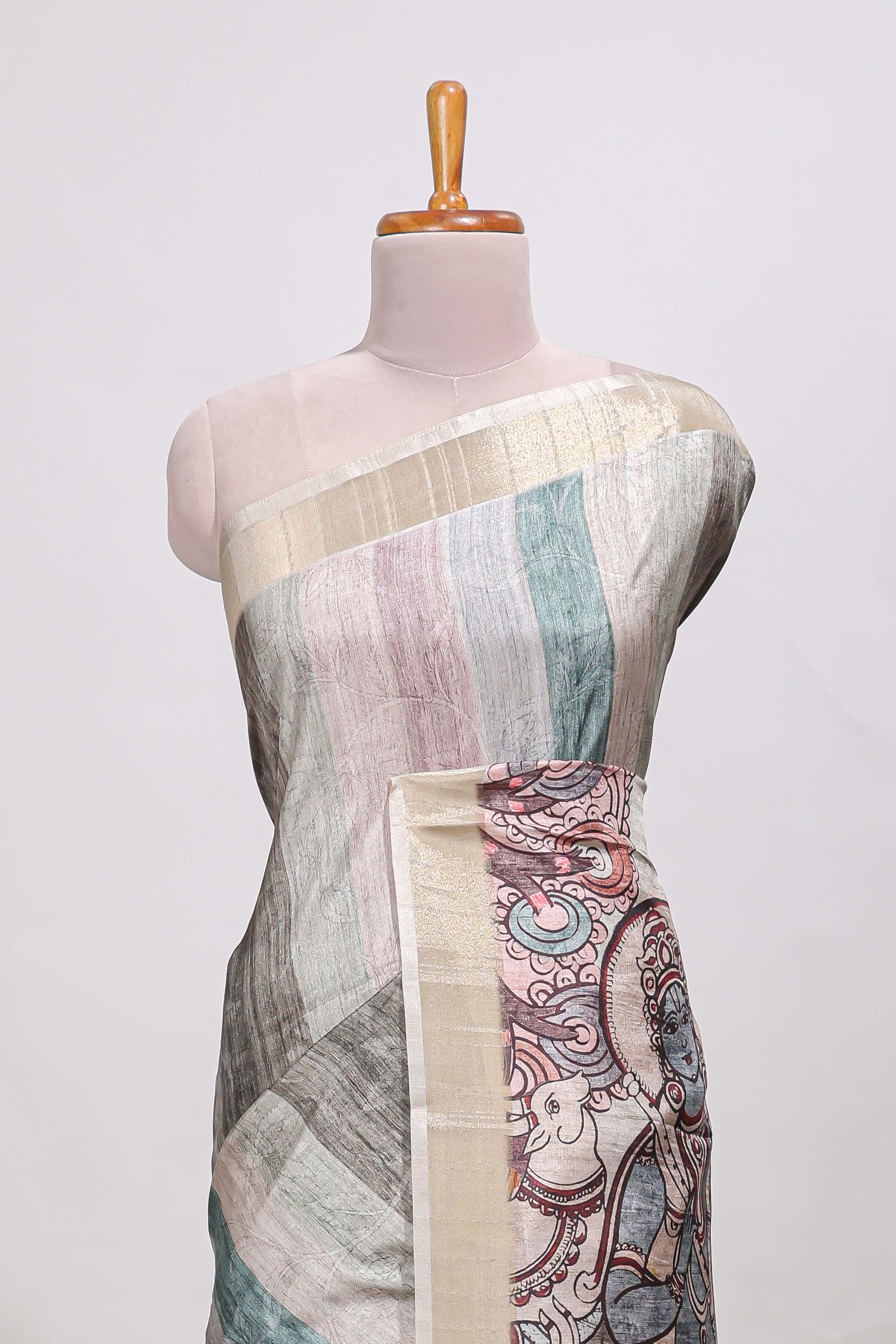 Multi colour kalamakri tussar saree body with floral creeper prints zari border and kalamkari peacock motif print pallu