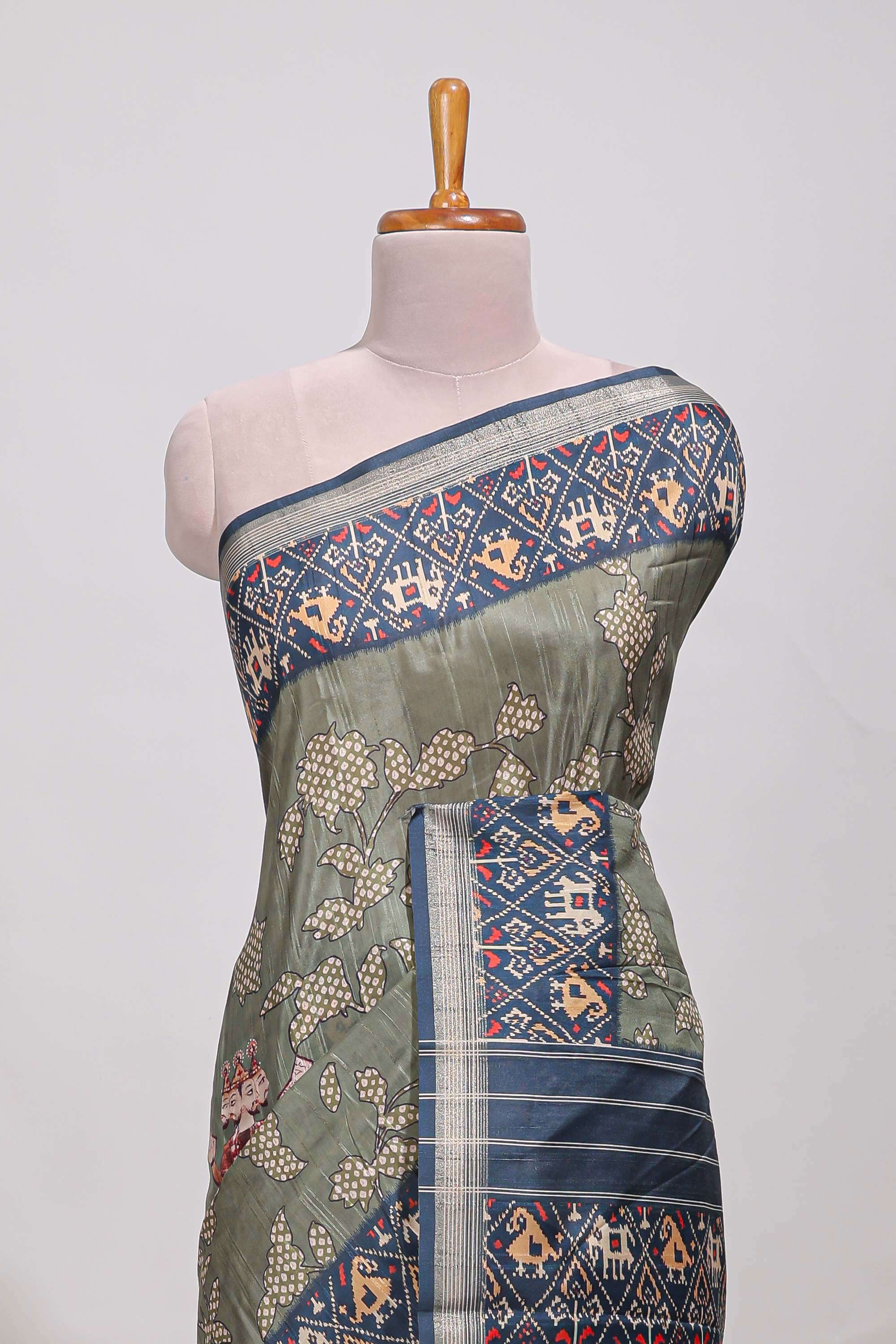 Olive green patola and pichwai tussar saree zari bordergeomatricmatching pallu along with tussels