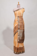 Orange geomatric tussar saree contrasting brown border with geomatric patterns ,and matching pallu with zari stripes blouse