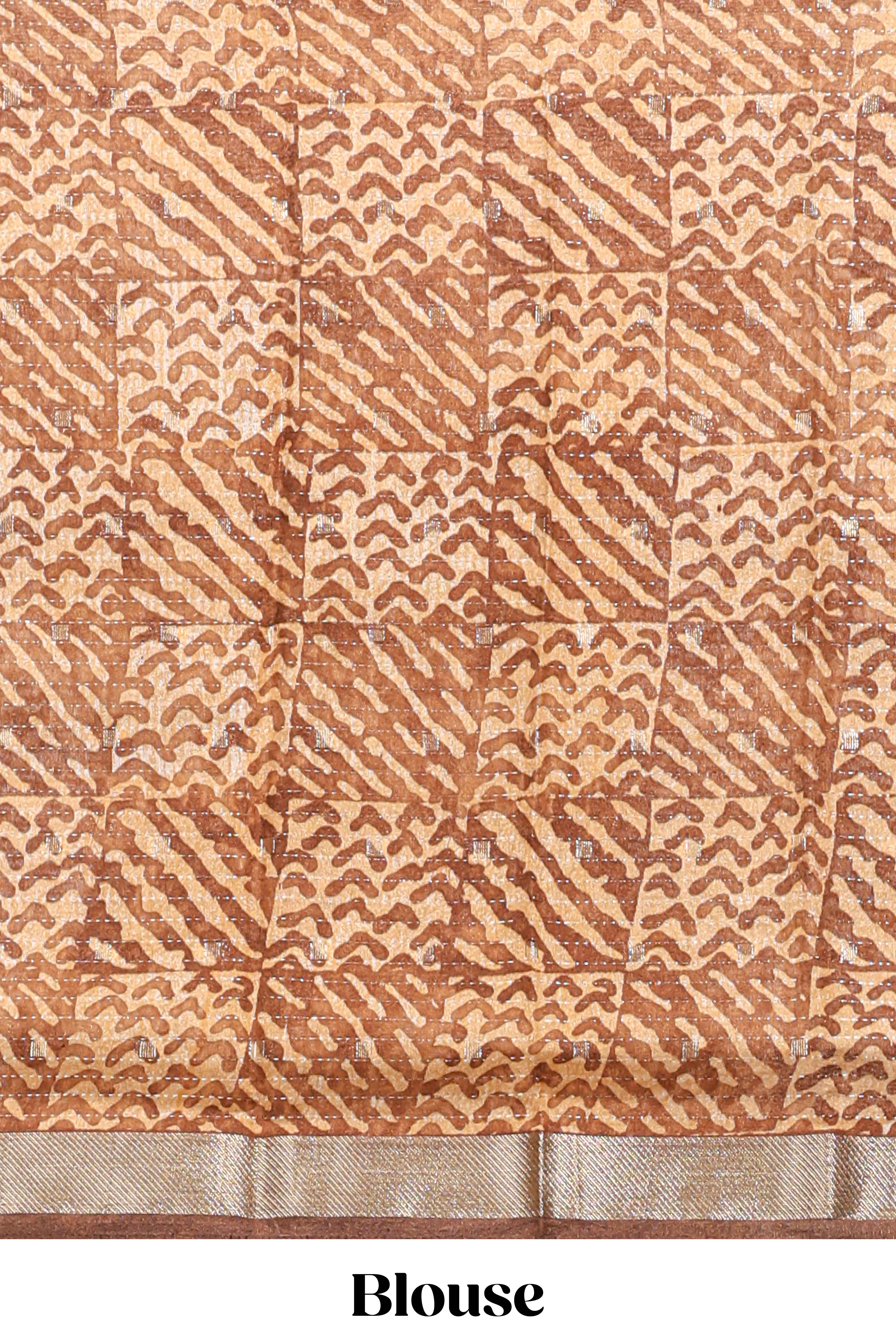 Orange geomatric tussar saree contrasting brown border with geomatric patterns ,and matching pallu with zari stripes blouse