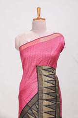 Bright pink semi tussar sareeall-over fine checked zari with border geometric zig-zag metallic weaving and contrast blouse