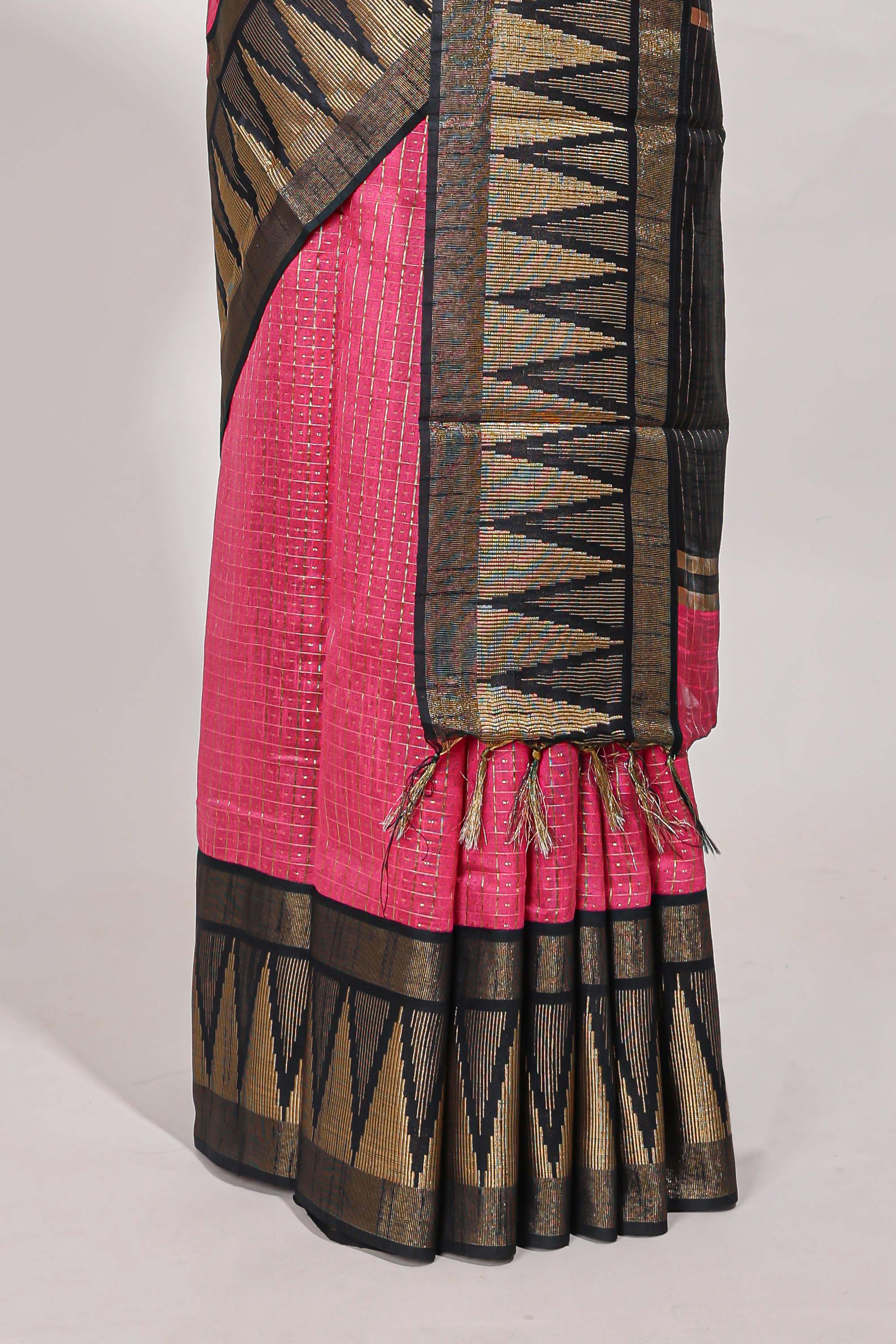 Bright pink semi tussar sareeall-over fine checked zari with border geometric zig-zag metallic weaving and contrast blouse