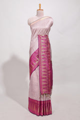 Peach semi tussar sareeall-over fine checked zari with border geometric zig-zag metallic weaving and contrast blouse