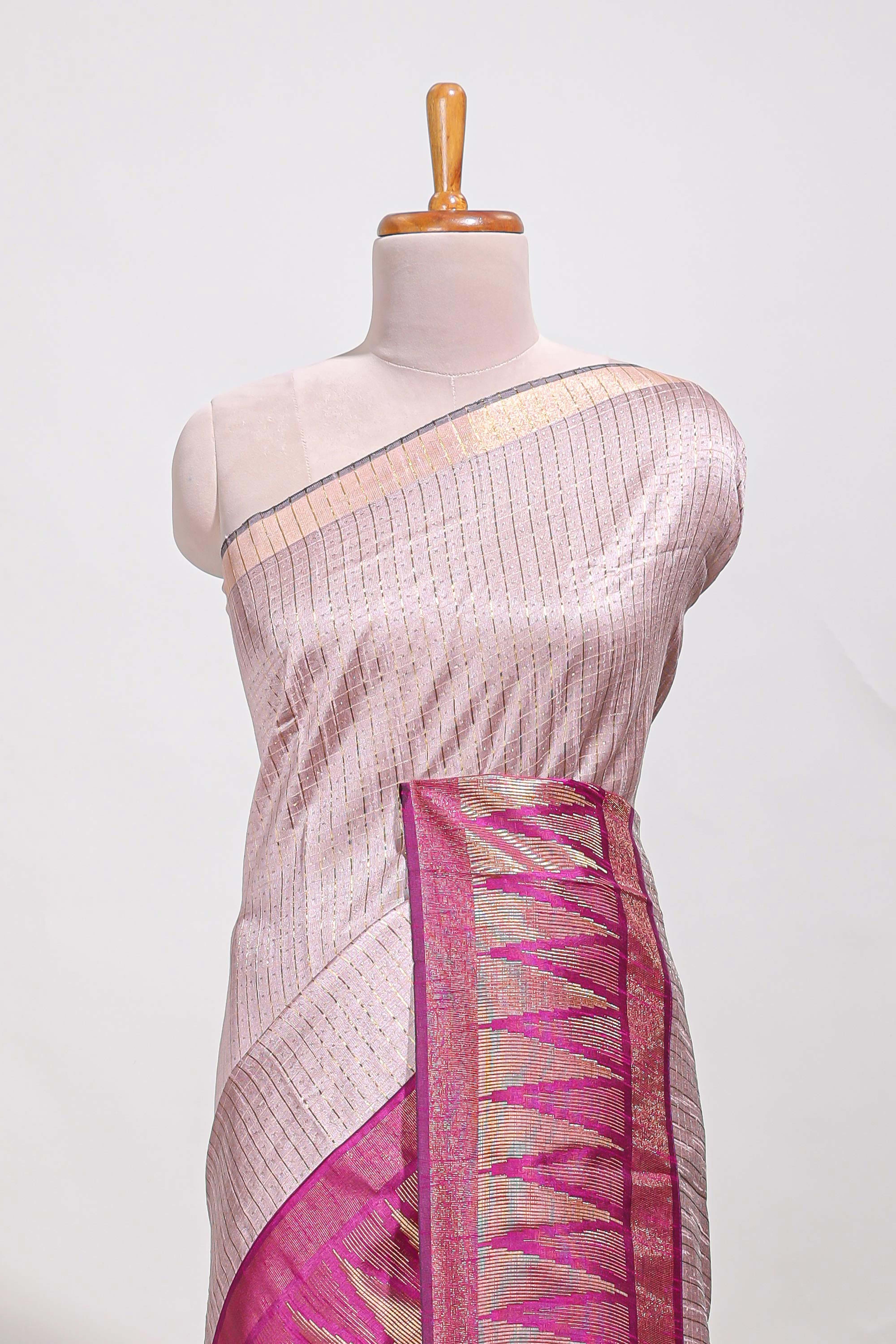 Peach semi tussar sareeall-over fine checked zari with border geometric zig-zag metallic weaving and contrast blouse