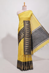 Yellow semi tussar sareeall-over fine checked zari with border geometric zig-zag metallic weaving and contrast blouse
