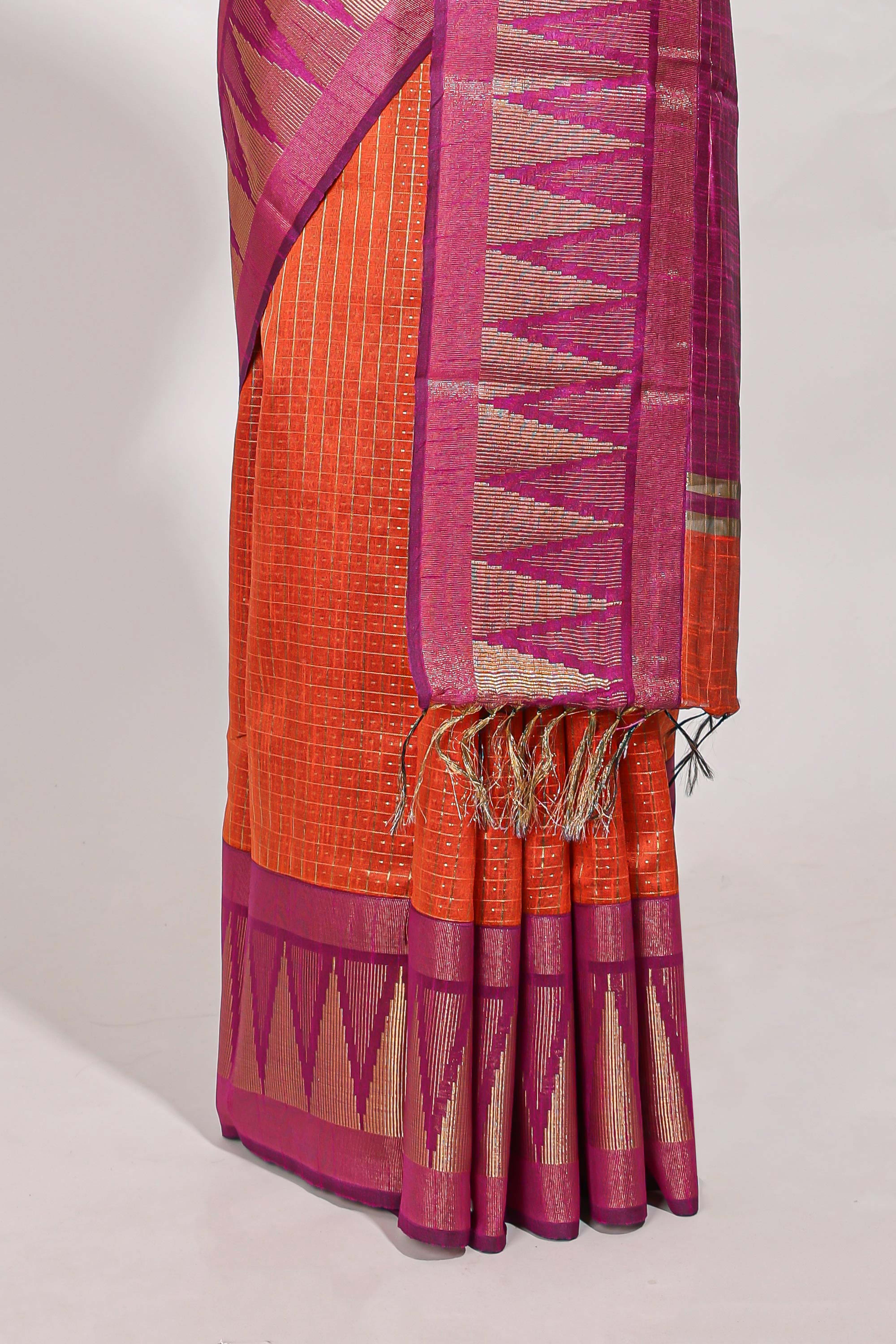 Orange semi tussar sareeall-over fine checked zari with border geometric zig-zag metallic weaving and contrast blouse