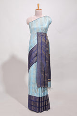 Powder blue silk body golden zari striped pattern and Broad golden zari border with contrast blouse