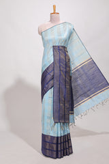 Powder blue silk body golden zari striped pattern and Broad golden zari border with contrast blouse