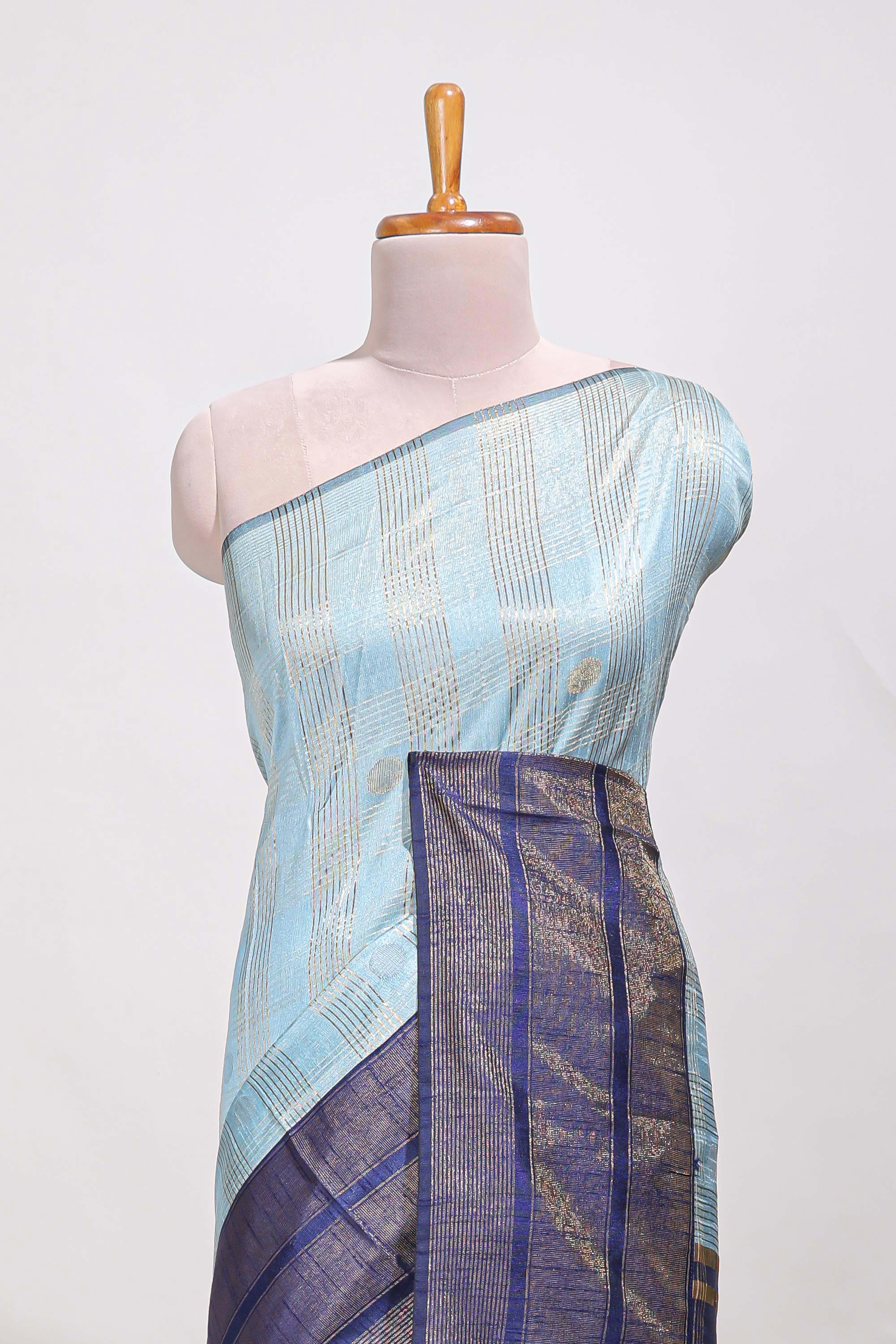 Powder blue silk body golden zari striped pattern and Broad golden zari border with contrast blouse