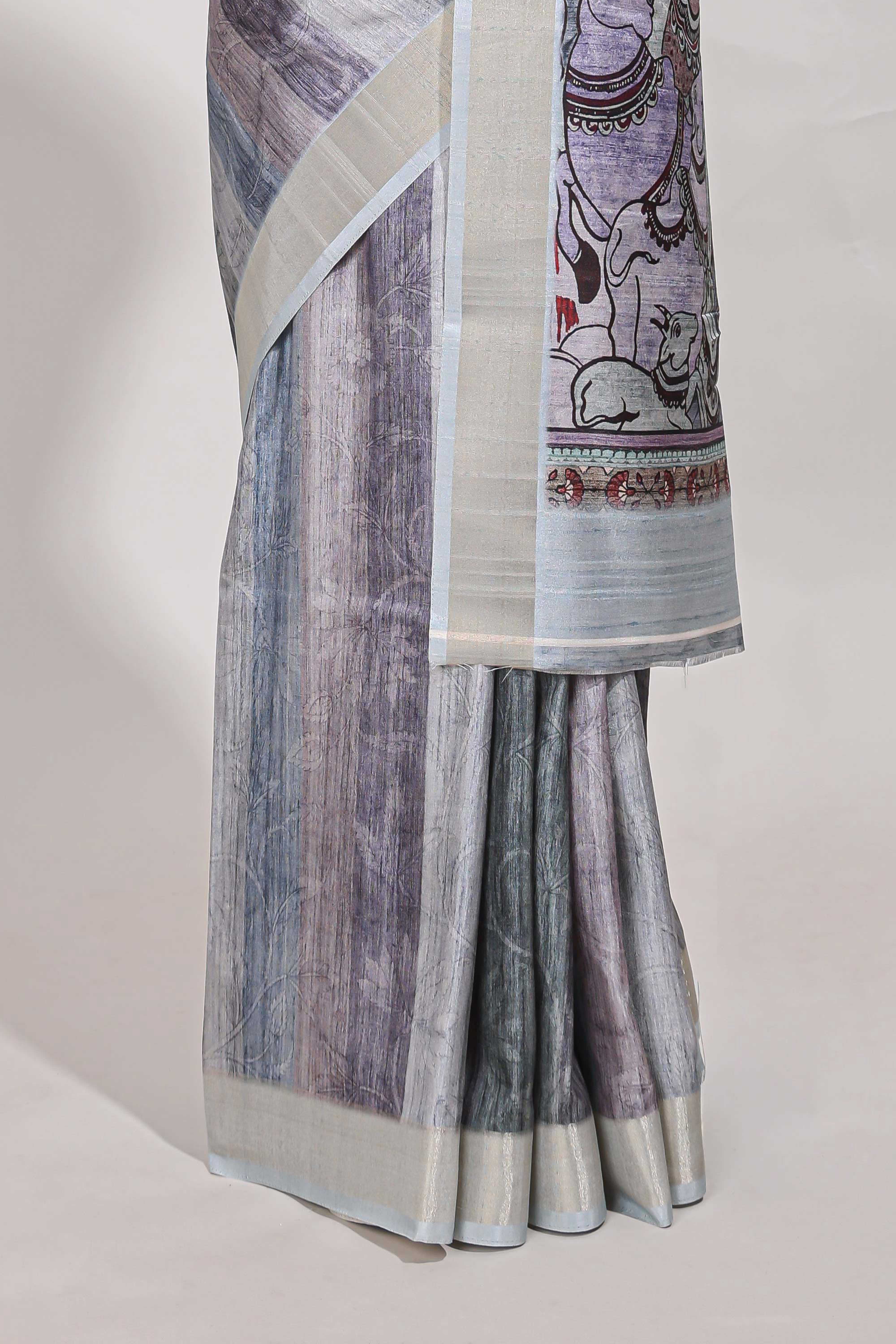 Multi colour kalamakri tussar sareewith floral creeper prints zari border and kalamkari peacock motif print pallu