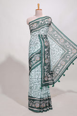 Green colour floral printedsemi tussar saree with creeperborder and matching printed blouse