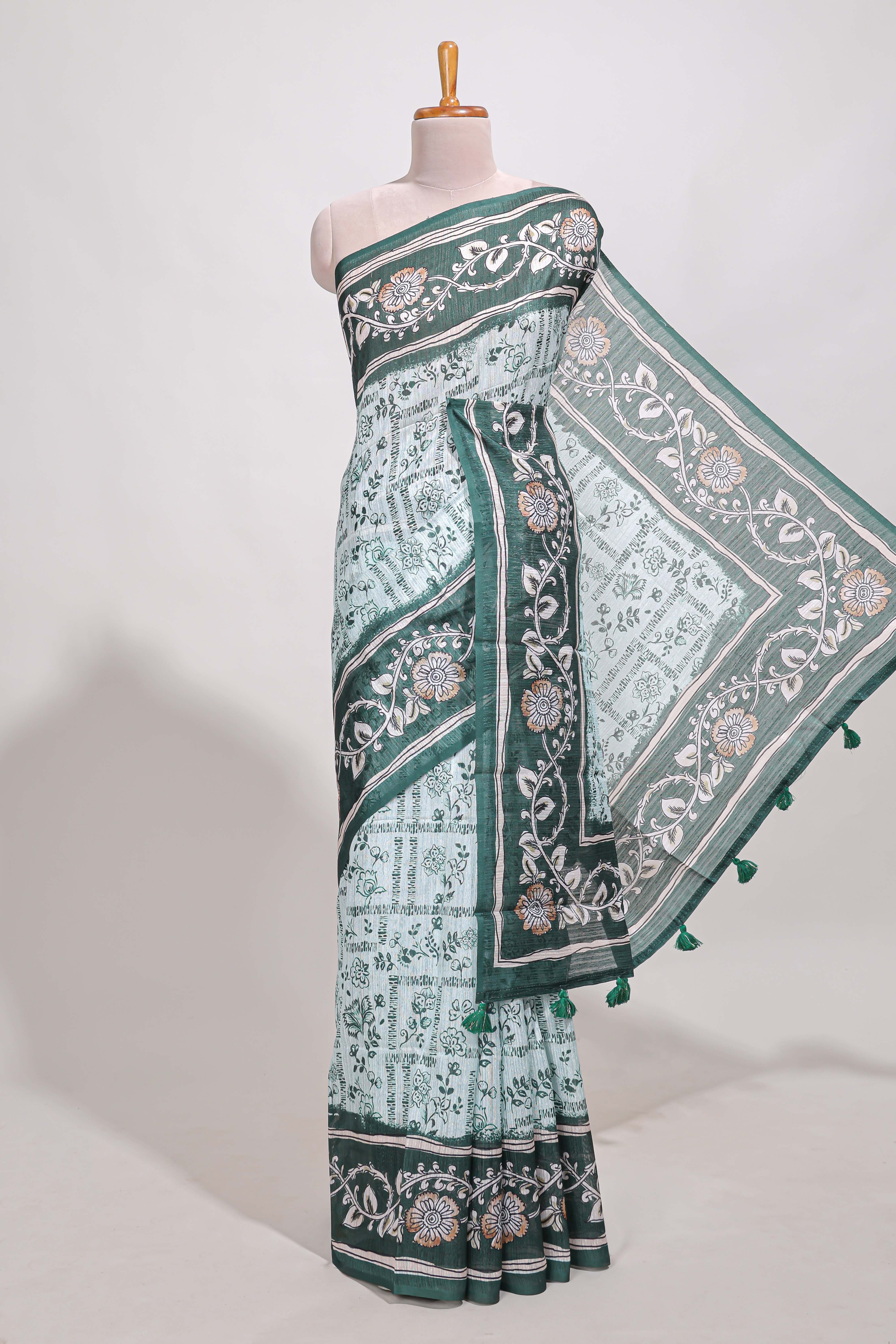 Green colour floral printedsemi tussar saree with creeperborder and matching printed blouse