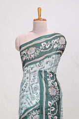 Green colour floral printedsemi tussar saree with creeperborder and matching printed blouse