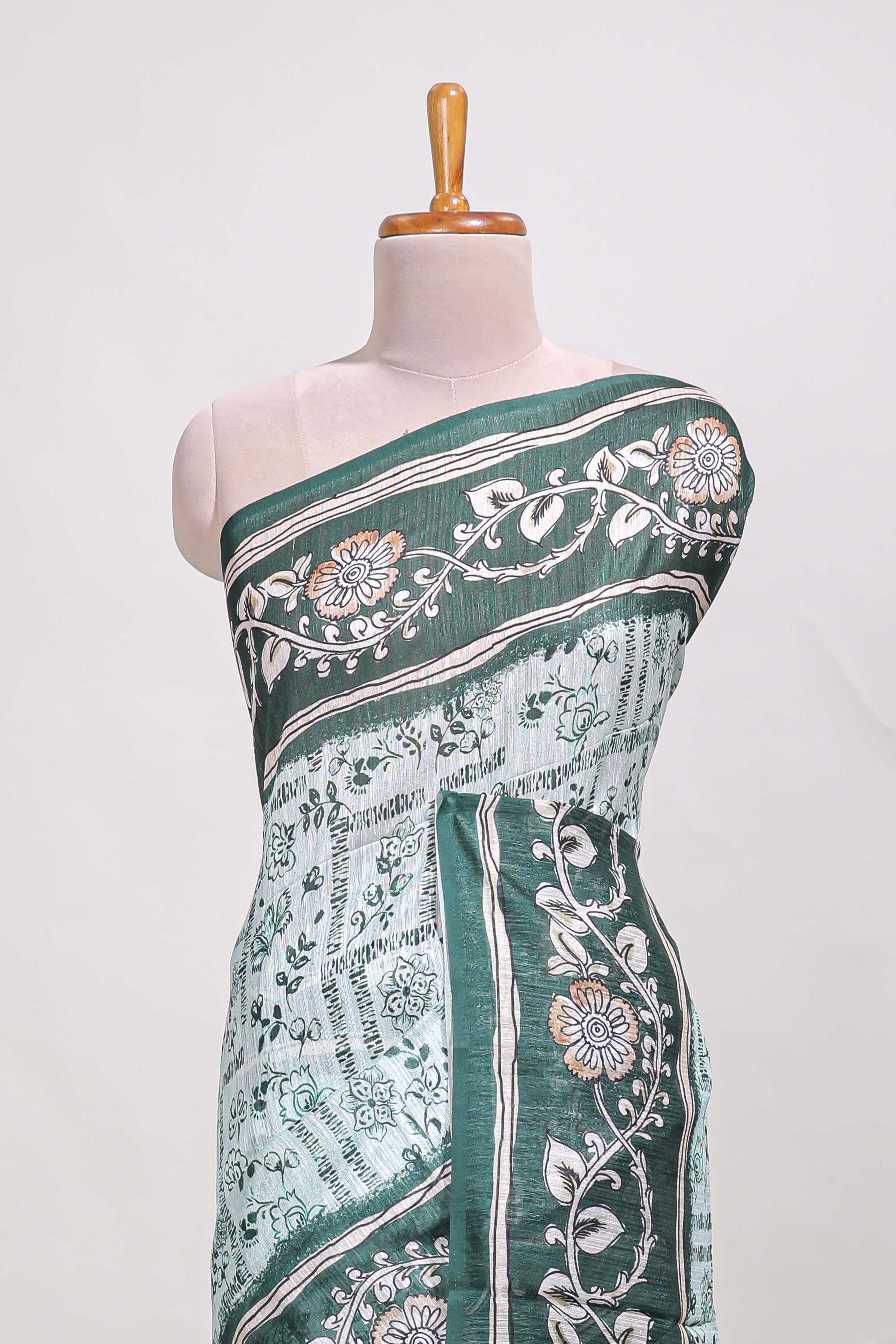 Green colour floral printedsemi tussar saree with creeperborder and matching printed blouse