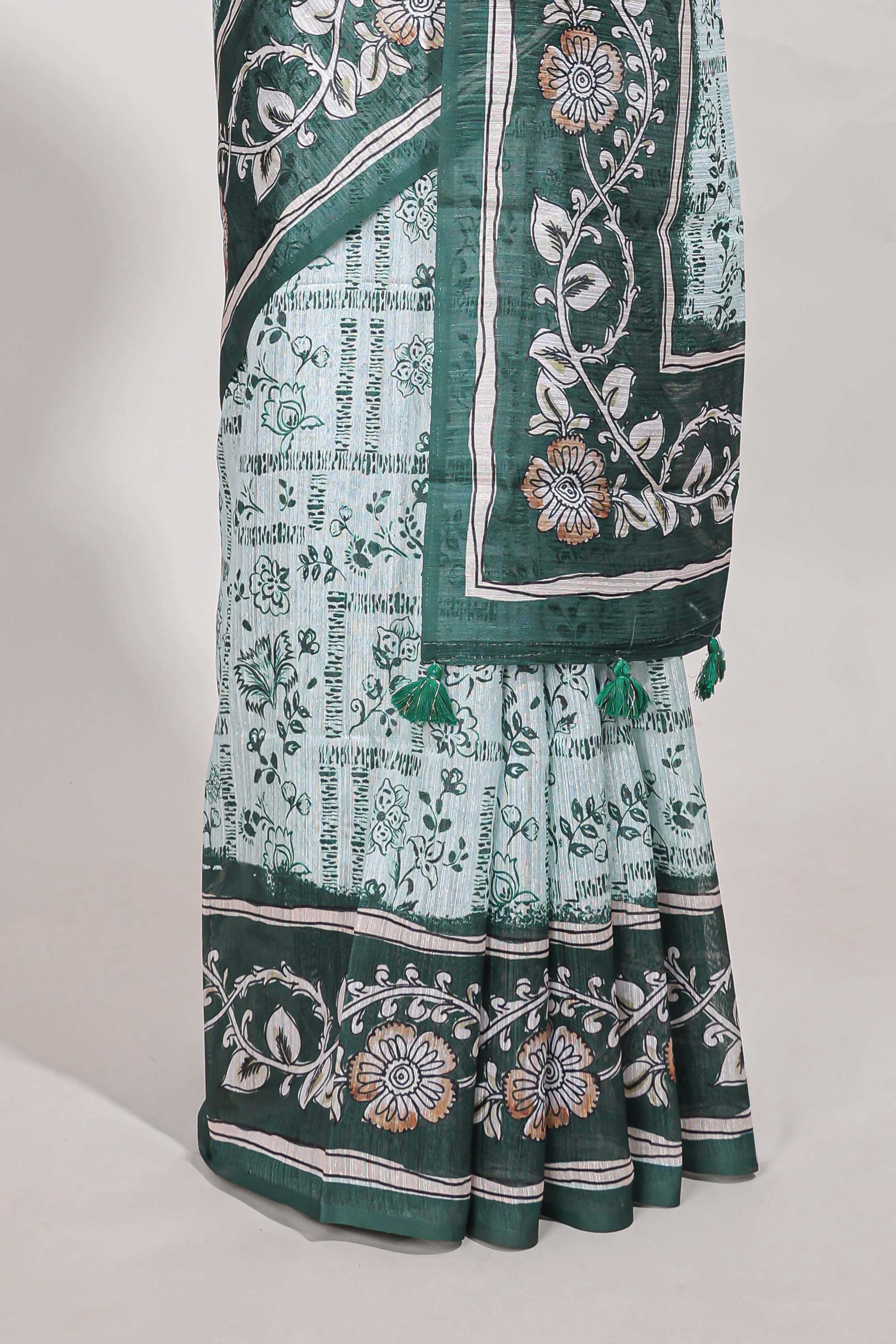 Green colour floral printedsemi tussar saree with creeperborder and matching printed blouse