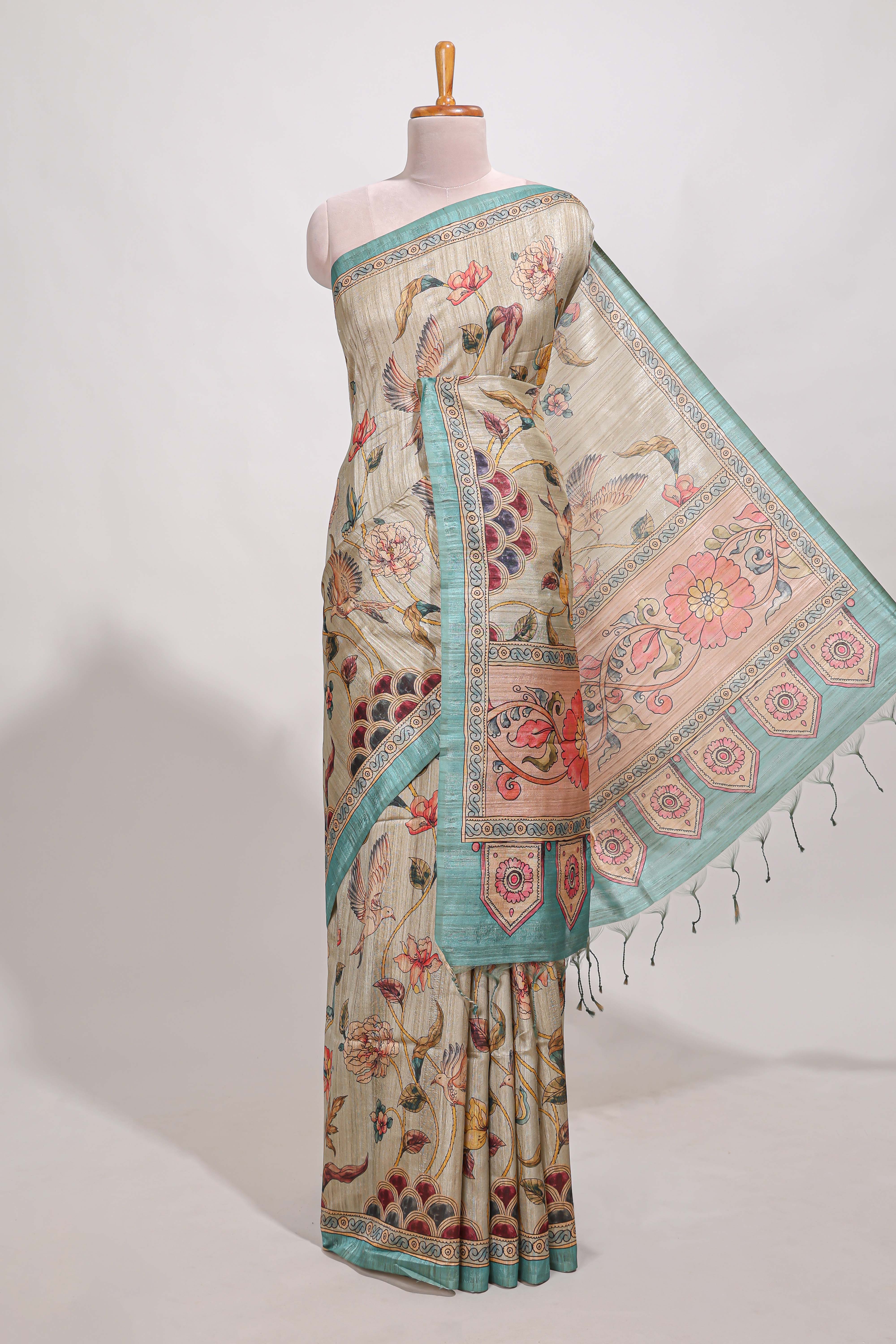 Cream colour semi tussar saree all over floral print with small contrast border and floral printed pallu with contrast blouse