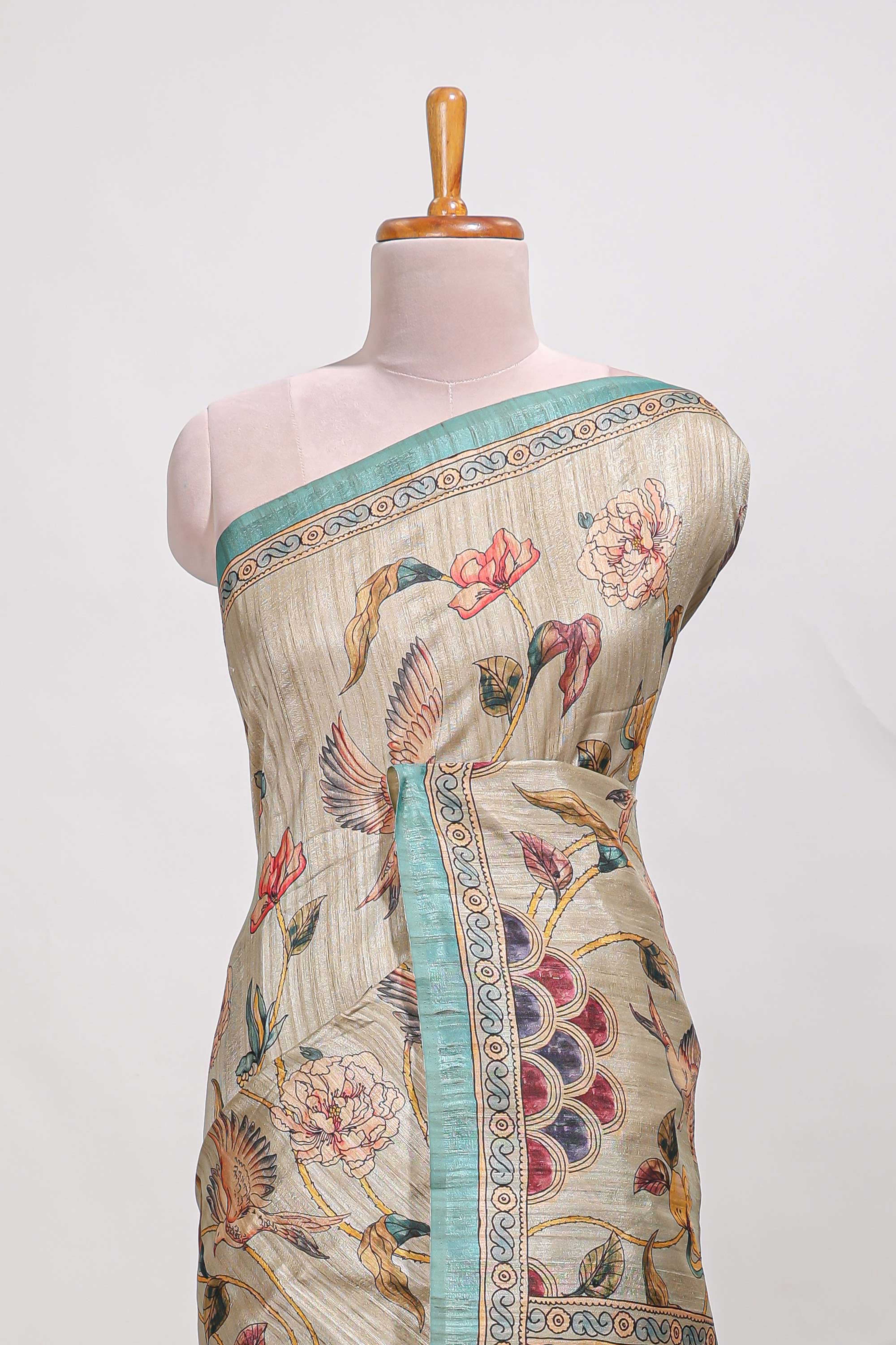 Cream colour semi tussar saree all over floral print with small contrast border and floral printed pallu with contrast blouse