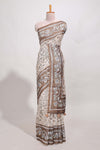 Brown colour floral printedsemi tussar saree with creeperborder and matching printed blouse