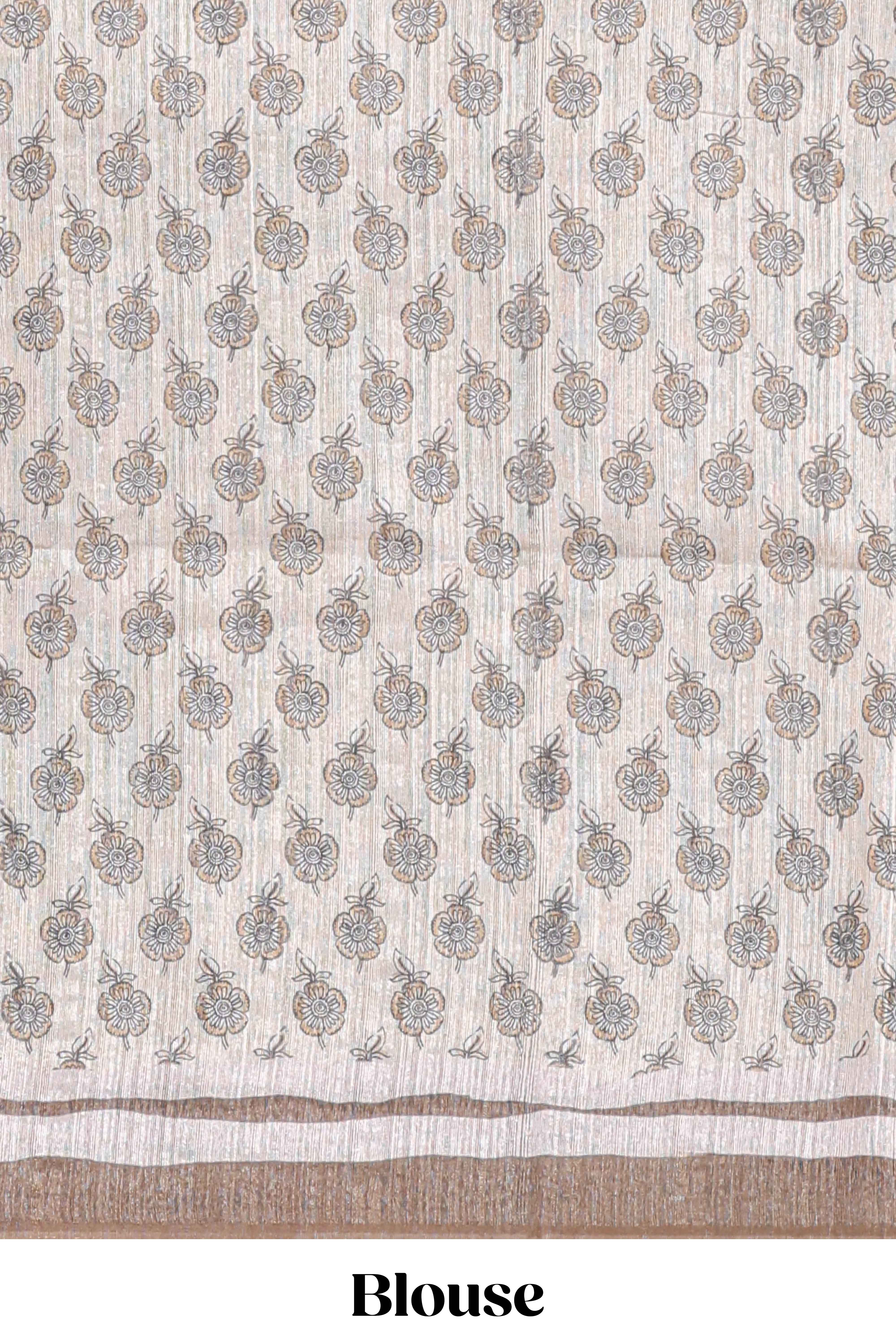 Brown colour floral printedsemi tussar saree with creeperborder and matching printed blouse