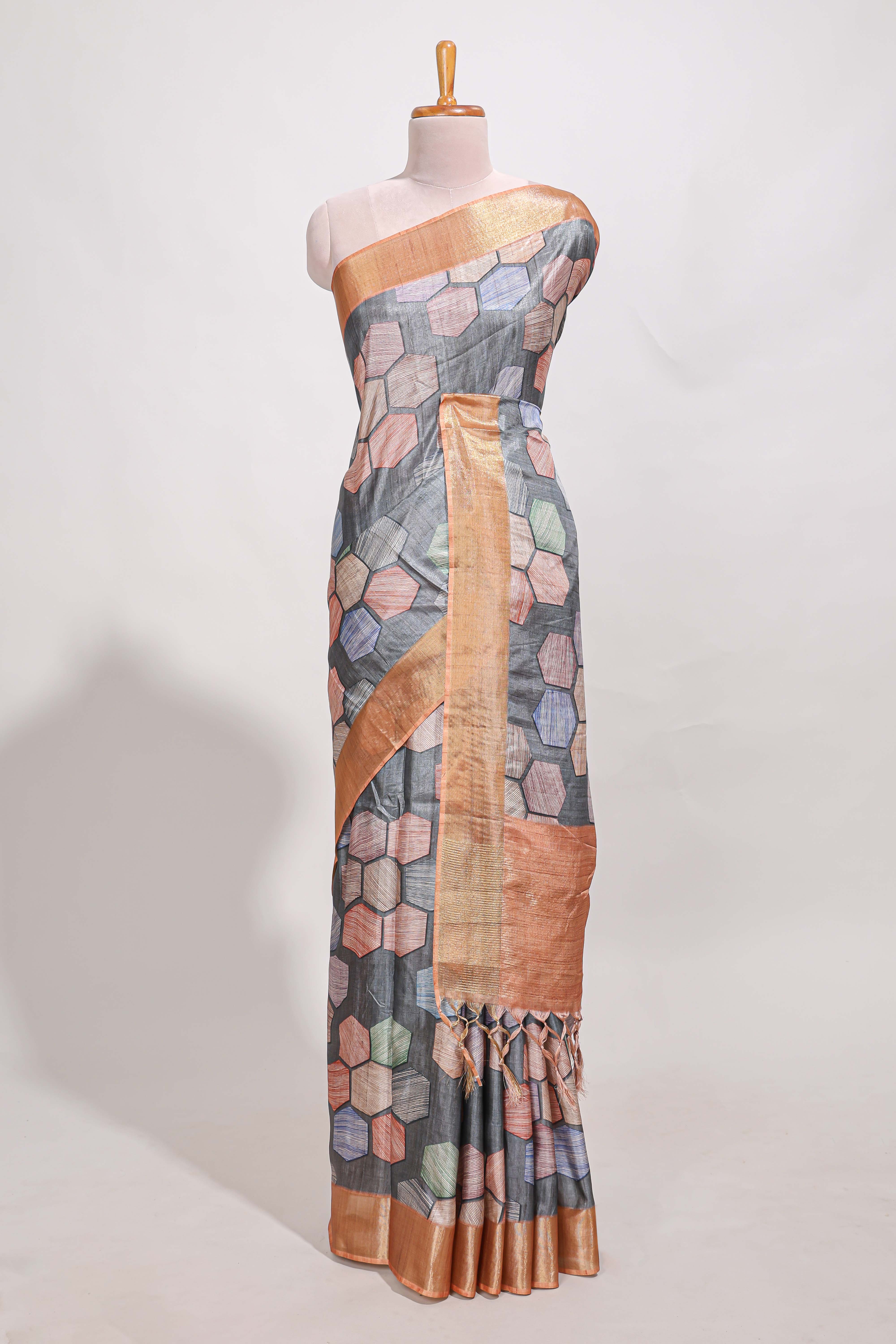 Grey geometrical tussar silk saree multi coloured honeycomb geomatricpatterns rich matching pallu along with tassles