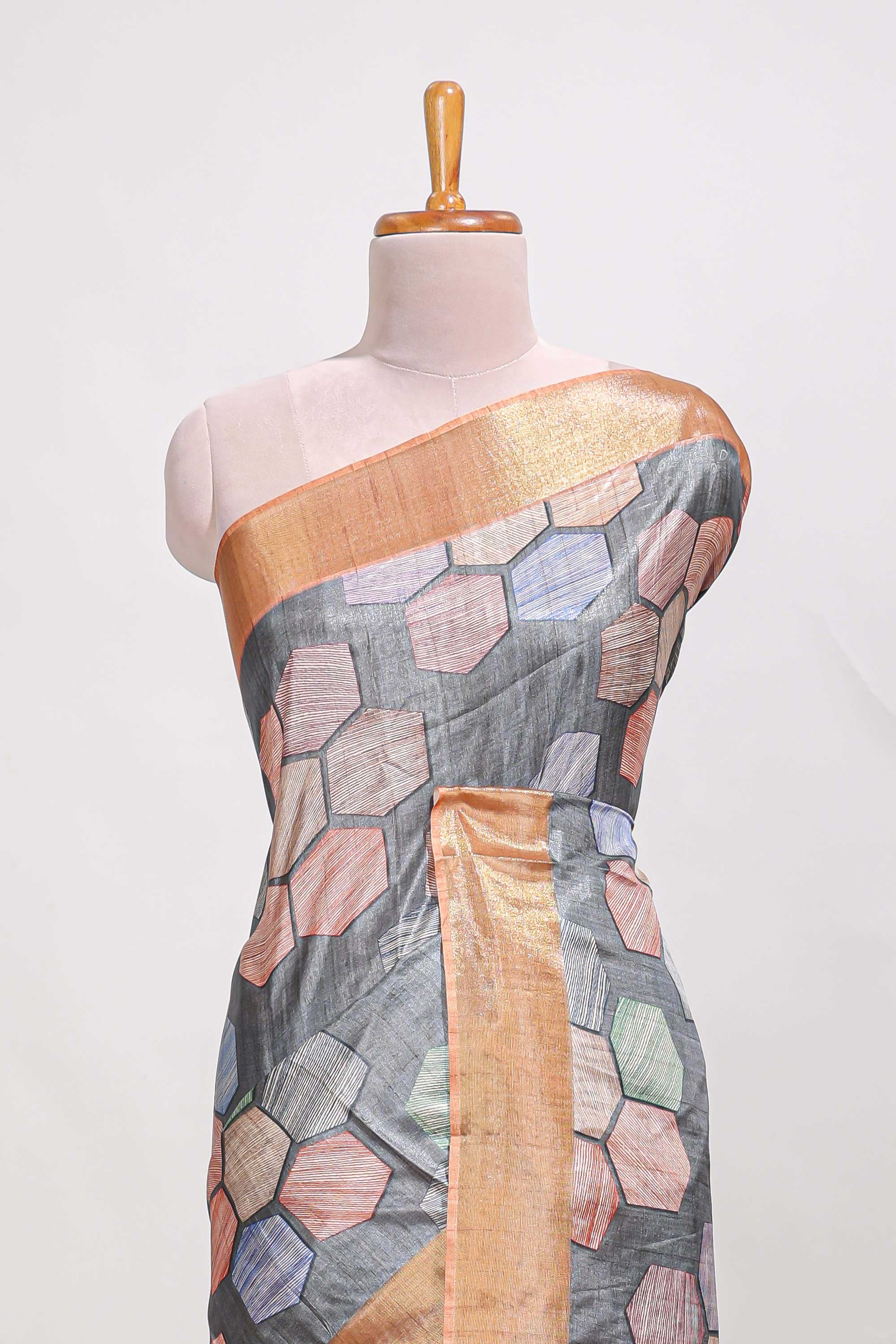 Grey geometrical tussar silk saree multi coloured honeycomb geomatricpatterns rich matching pallu along with tassles