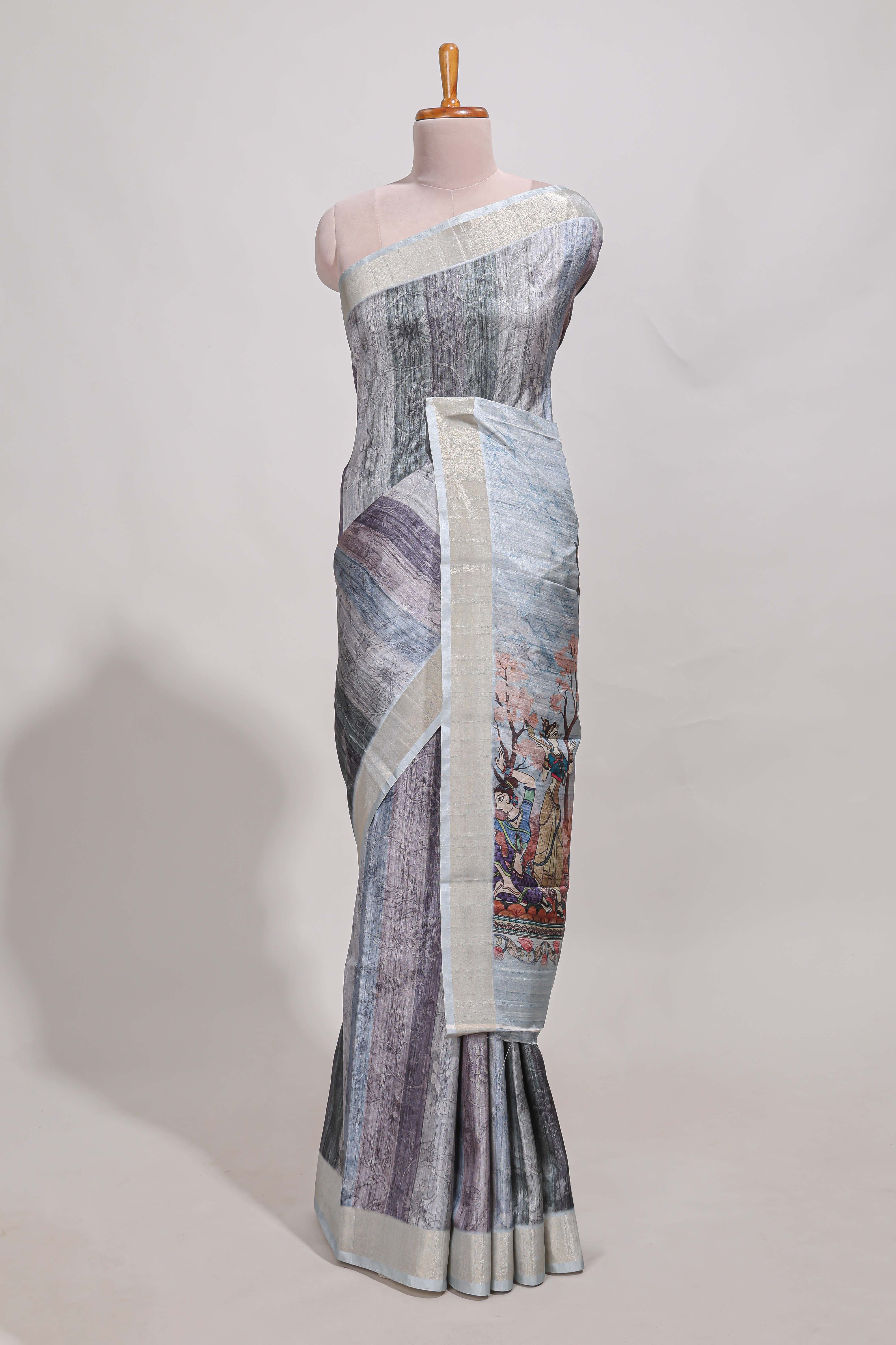 Grey kalamakri arttussar sareewith floral creeper prints zari border and dancing figures print pallu