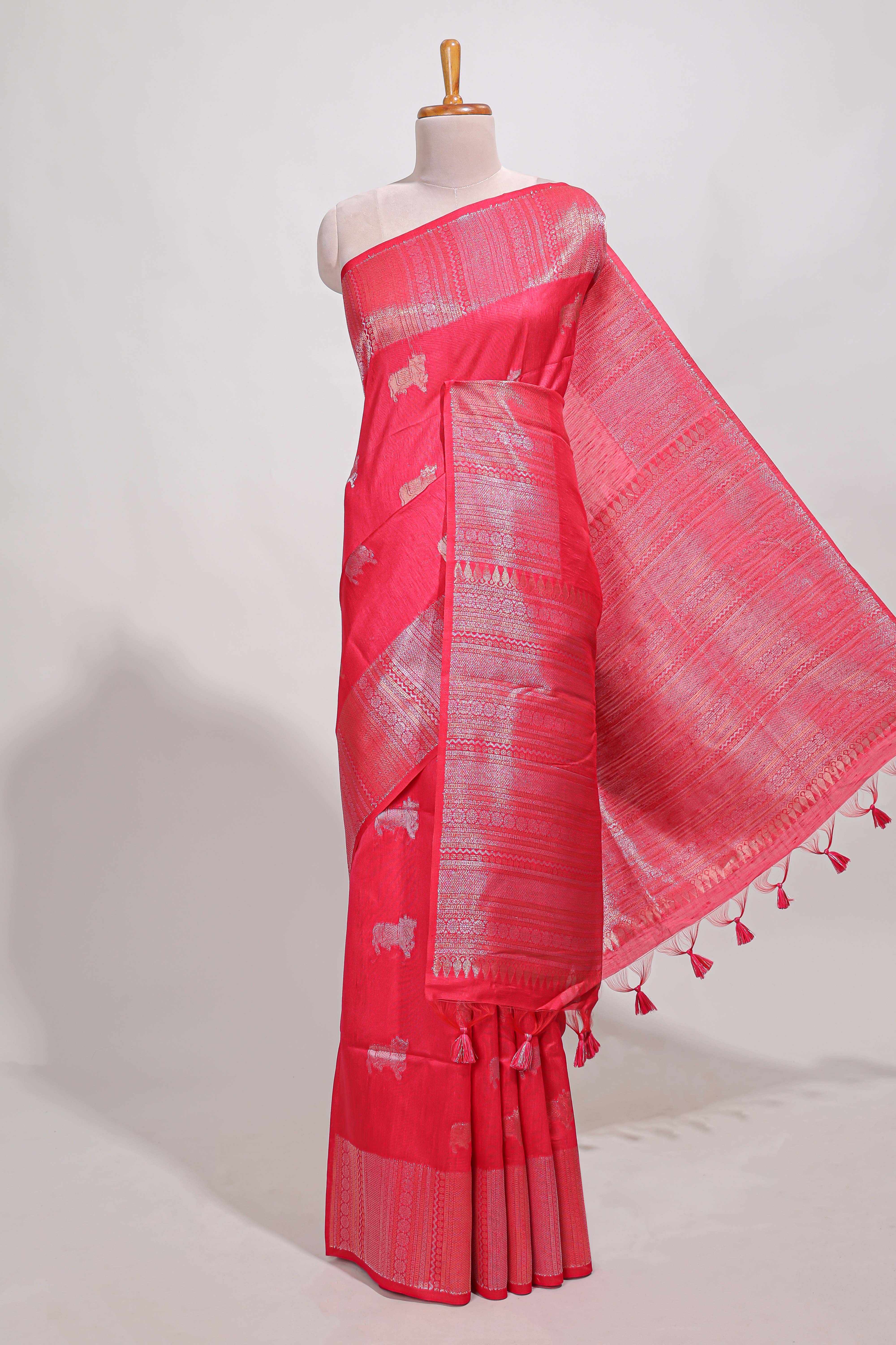 Bright pink semi tussar saree all over pichwai buttas and sliver zari pallu with self blouse