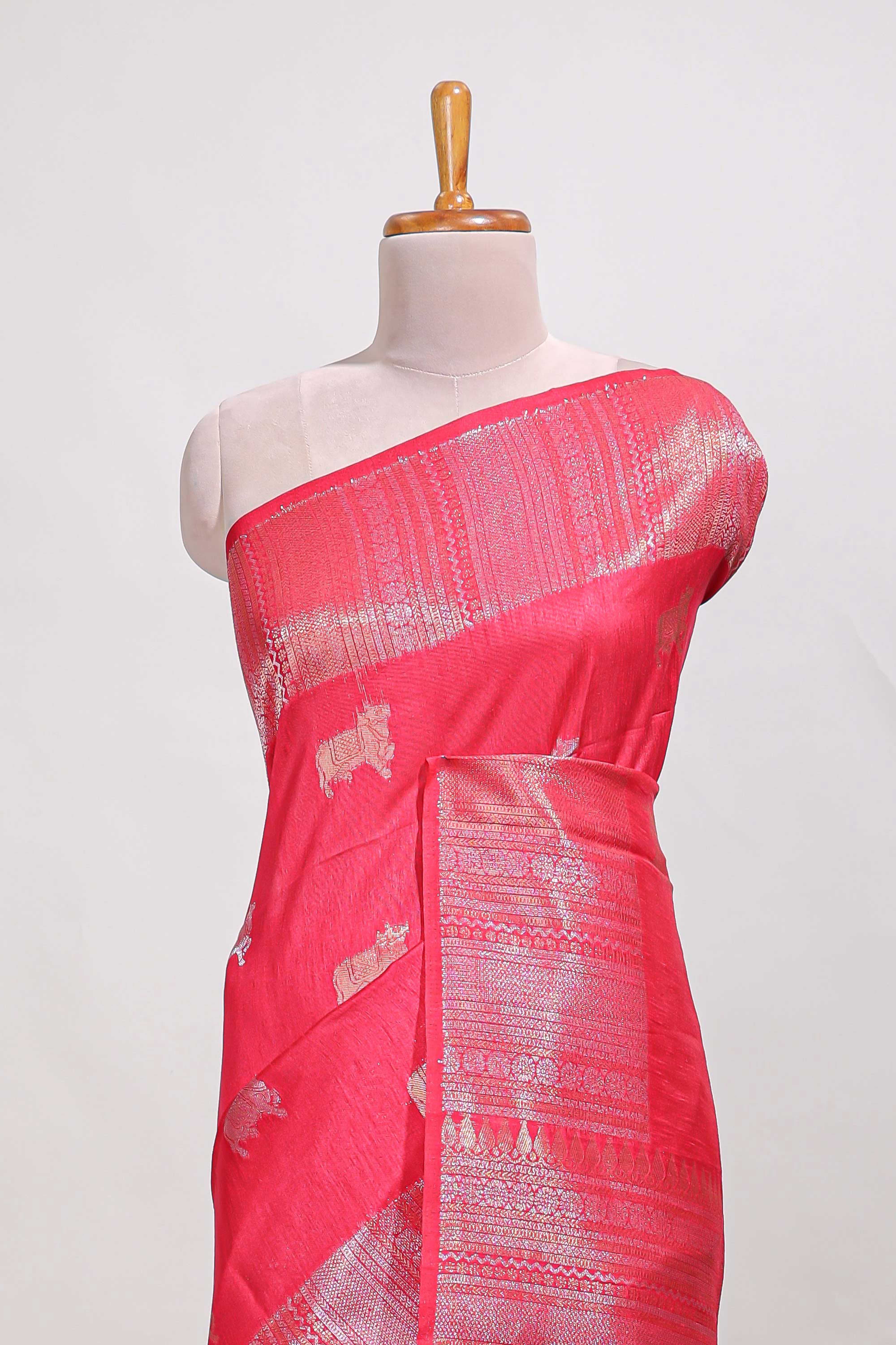 Bright pink semi tussar saree all over pichwai buttas and sliver zari pallu with self blouse