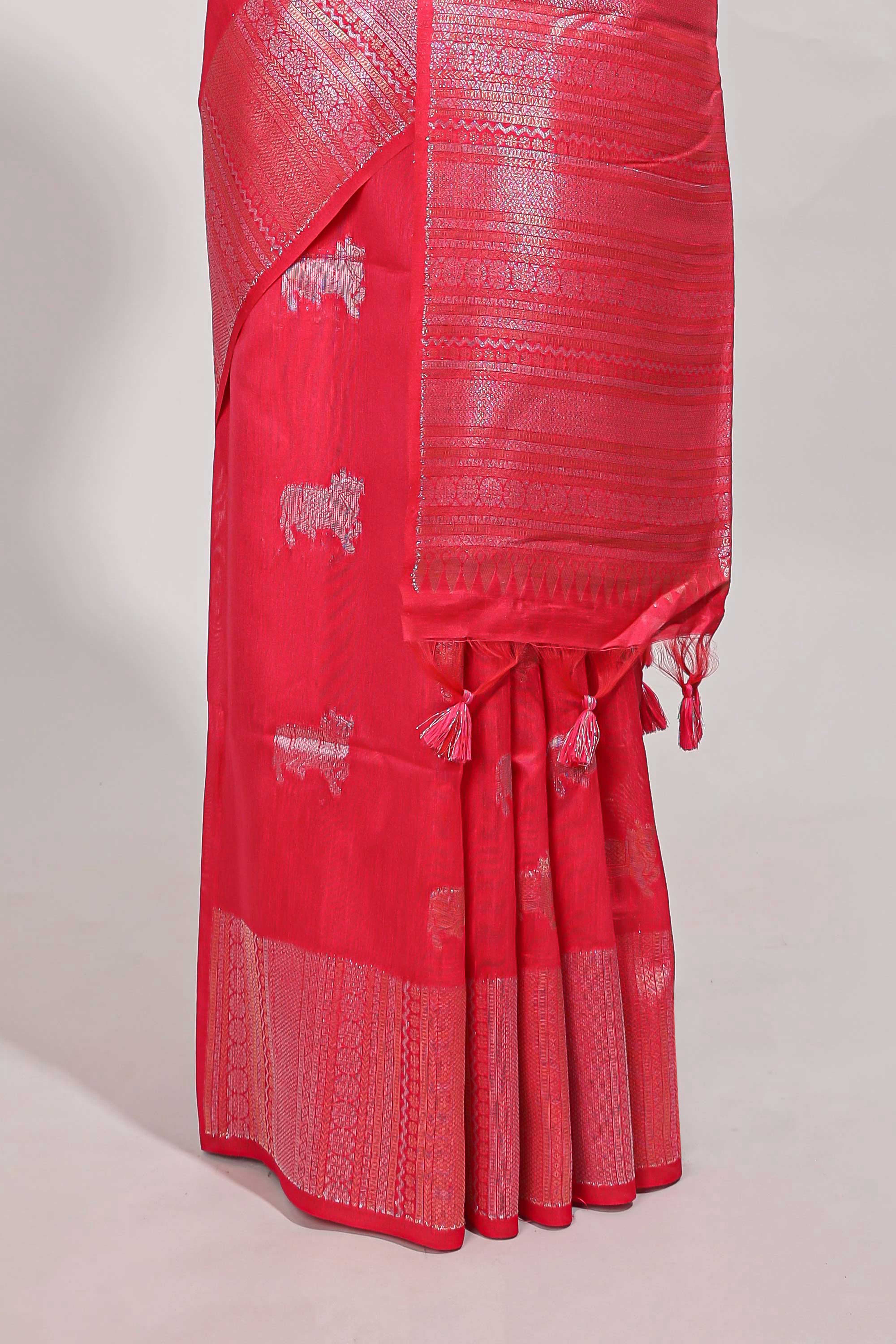 Bright pink semi tussar saree all over pichwai buttas and sliver zari pallu with self blouse