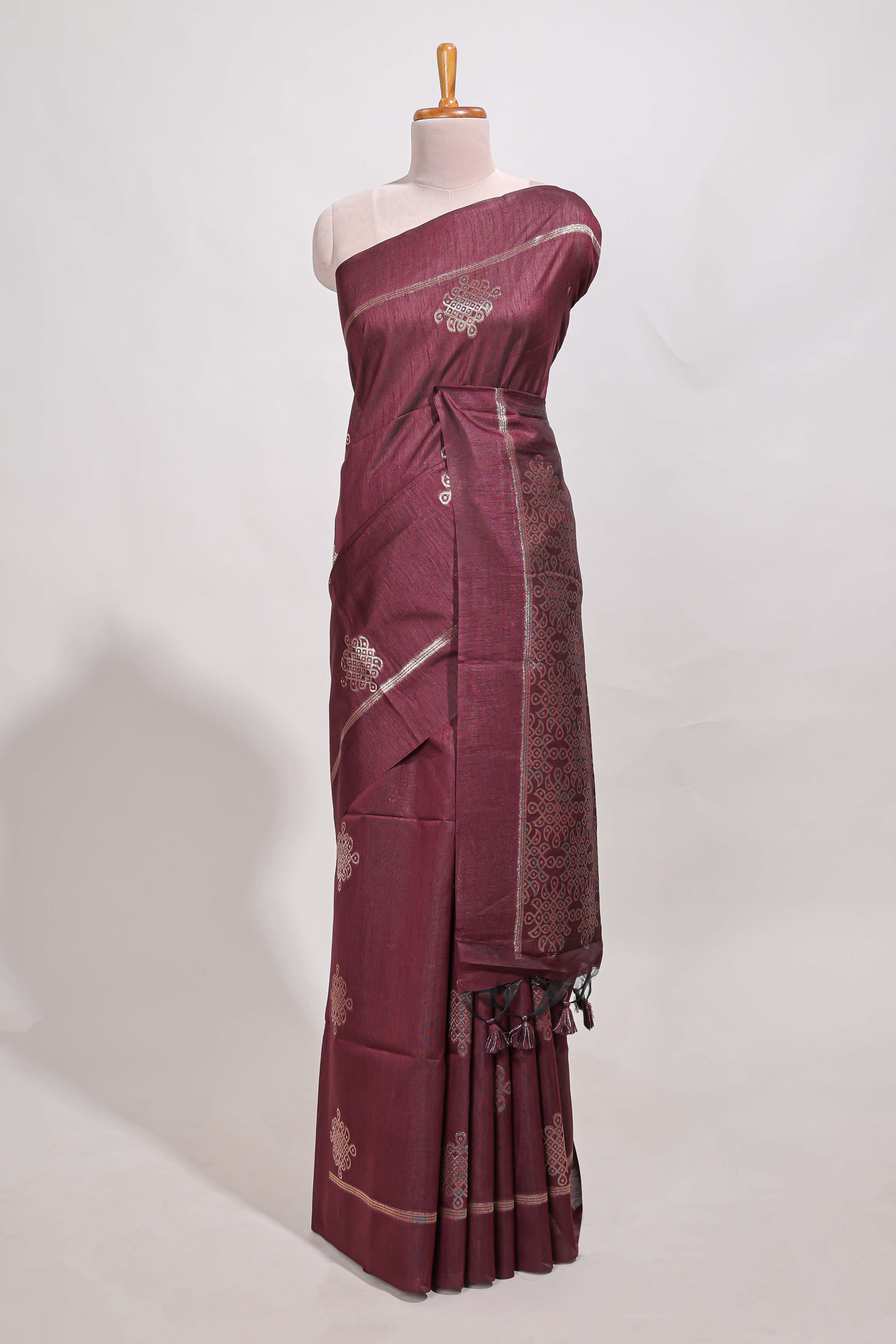 Dark maroon semi tussar saree all over pichwai buttas and sliver zari pallu with self blouse