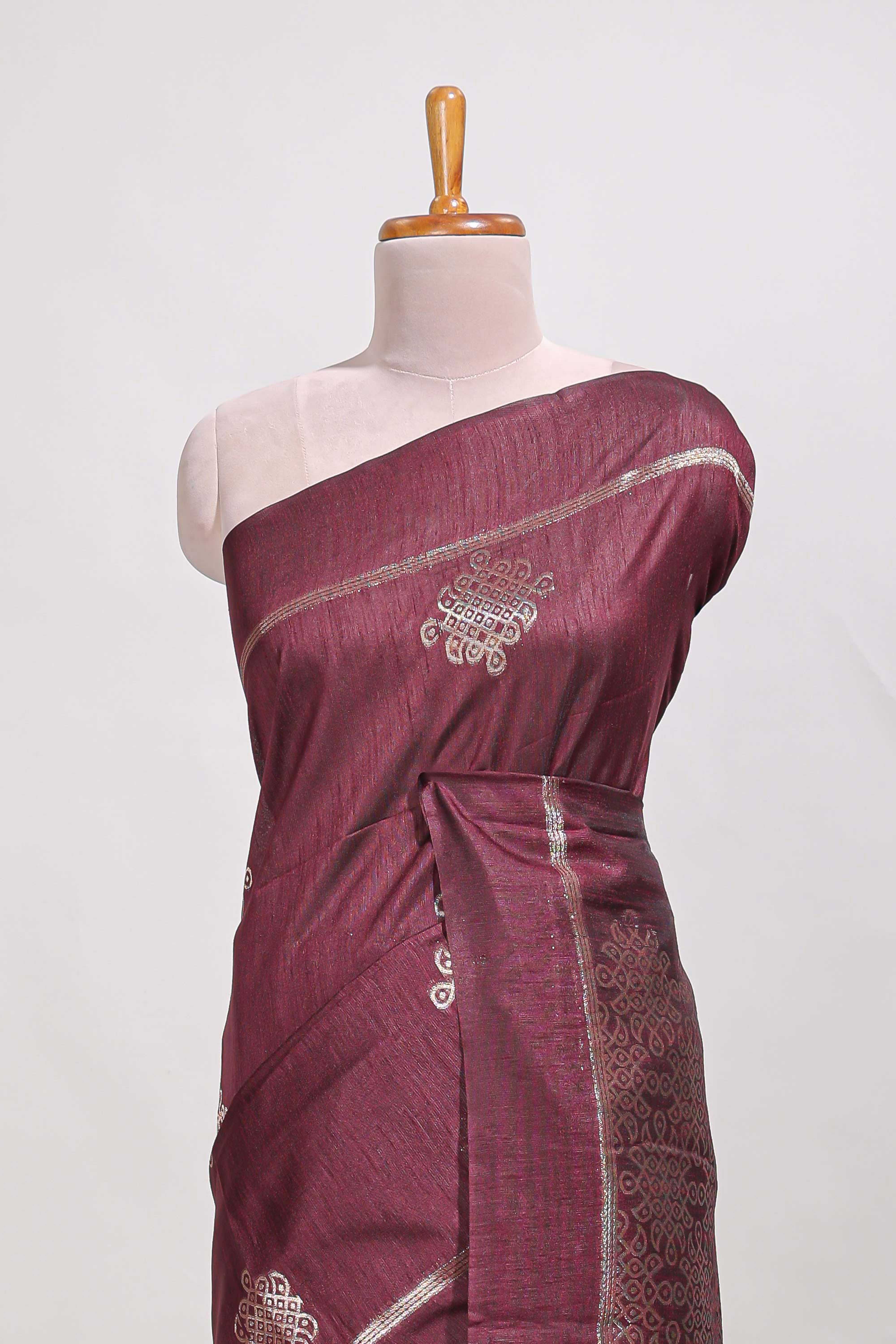 Dark maroon semi tussar saree all over pichwai buttas and sliver zari pallu with self blouse