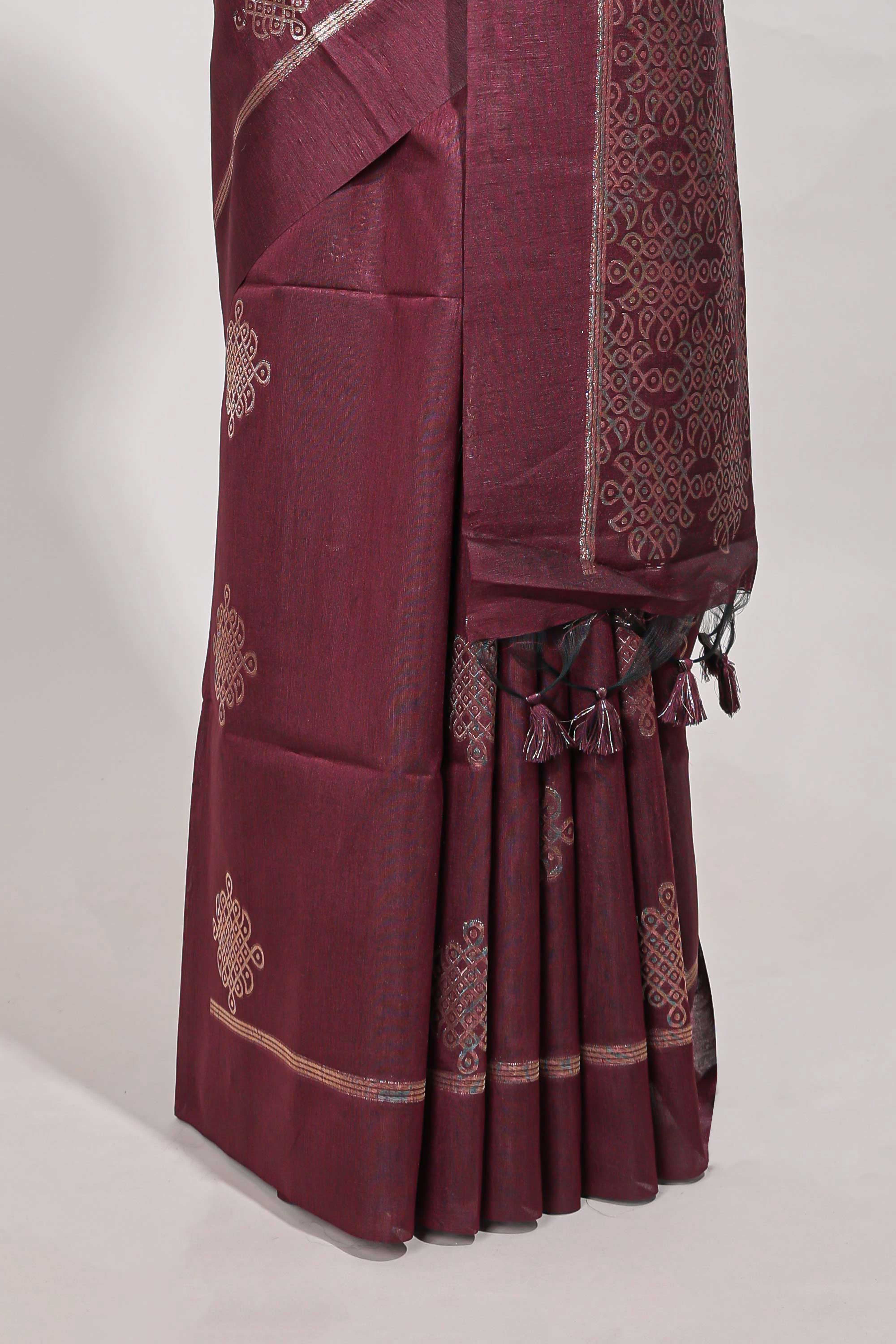 Dark maroon semi tussar saree all over pichwai buttas and sliver zari pallu with self blouse
