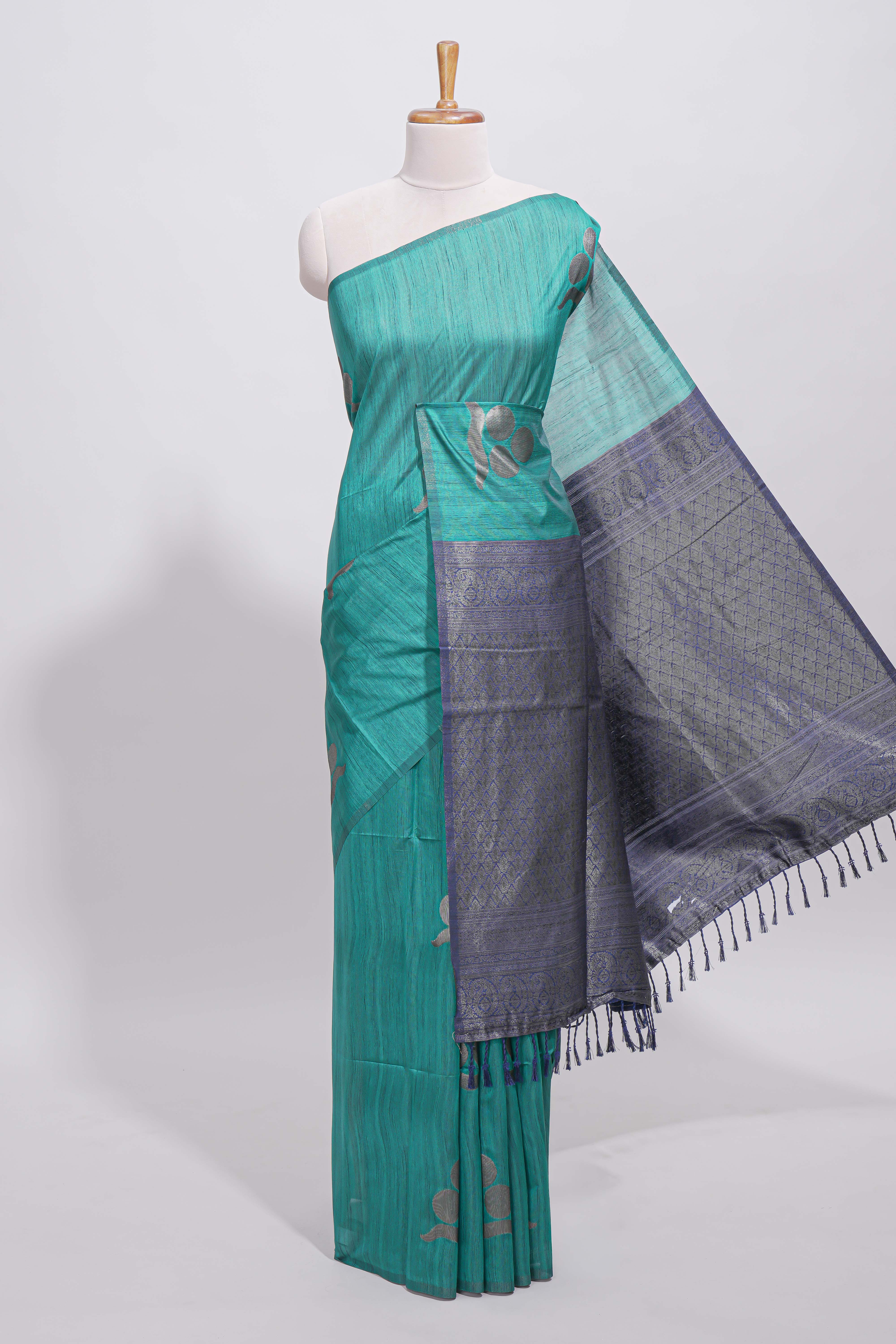 Borderless peacock green round butta art tussar saree with contrast pallu and blouse
